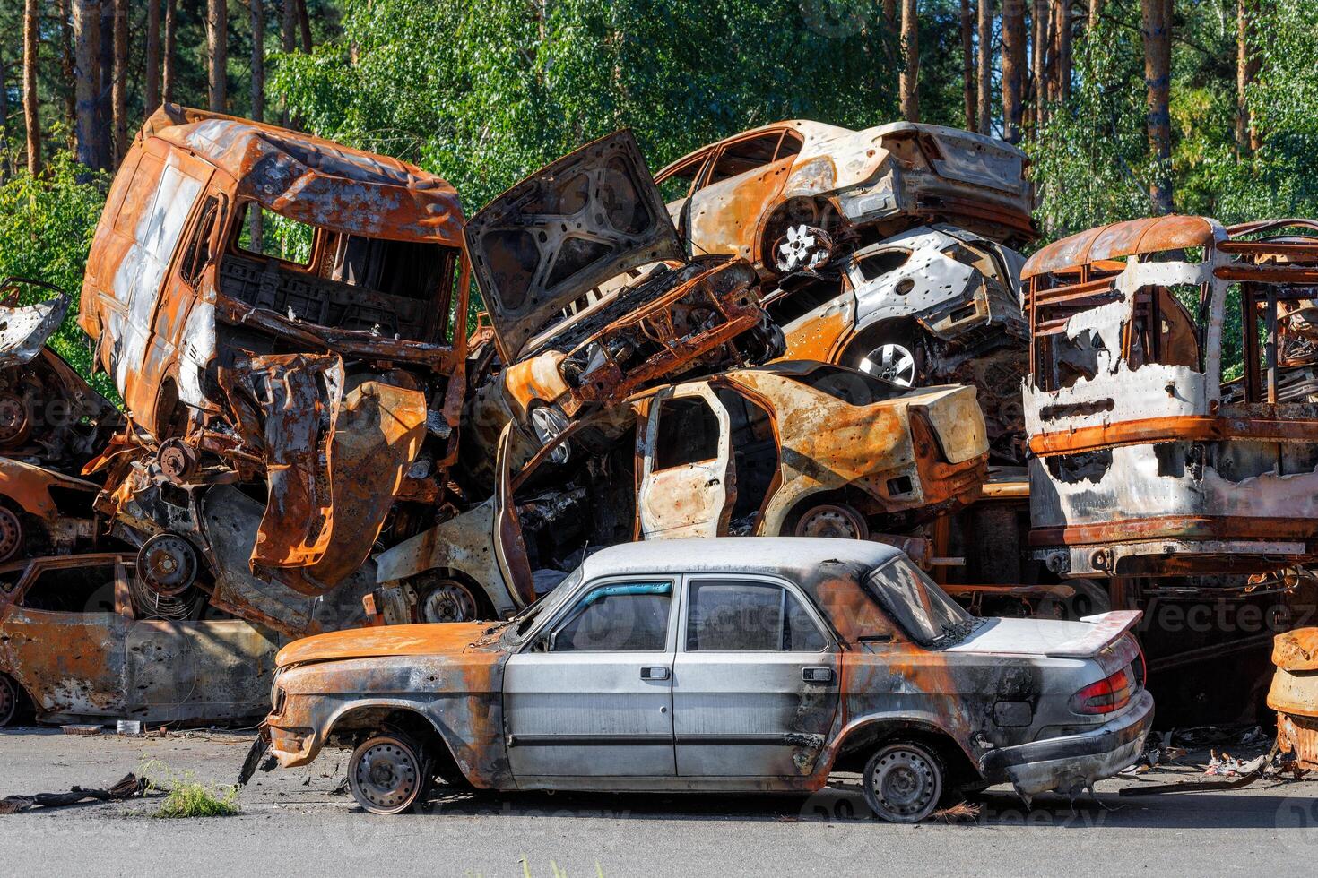 Skeletons of burned cars piled up after the expulsion of Russian invaders near the city of Irpin near Kyiv. photo