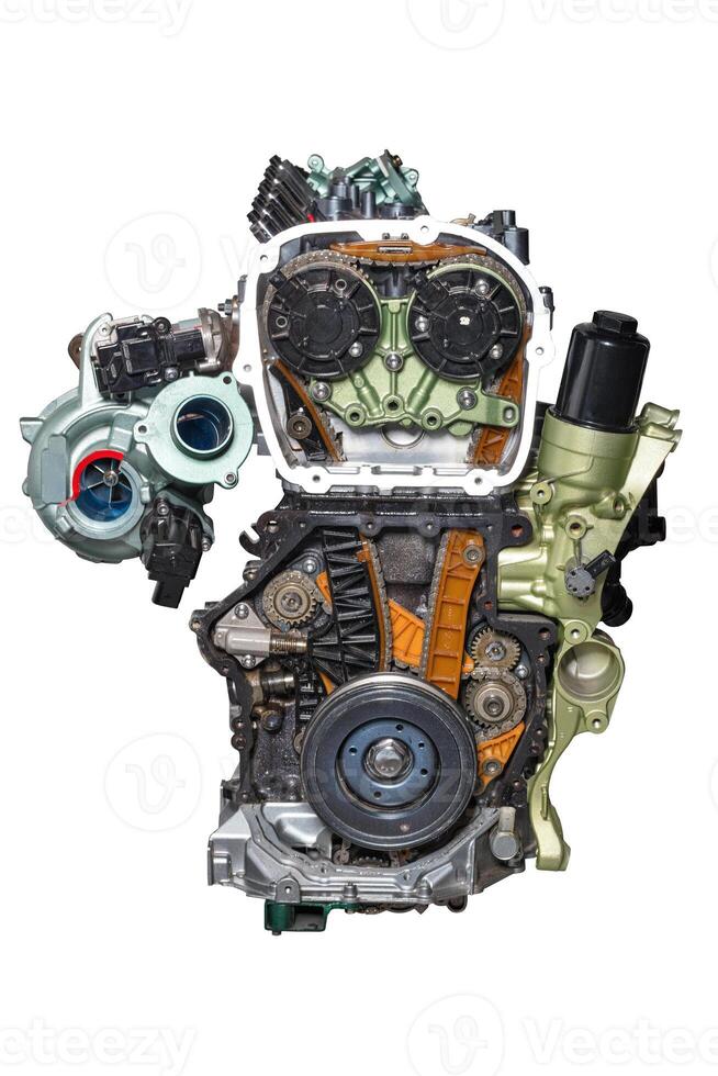 The internal combustion engine of a modern car on a stand in the cut. Isolated on white background. photo