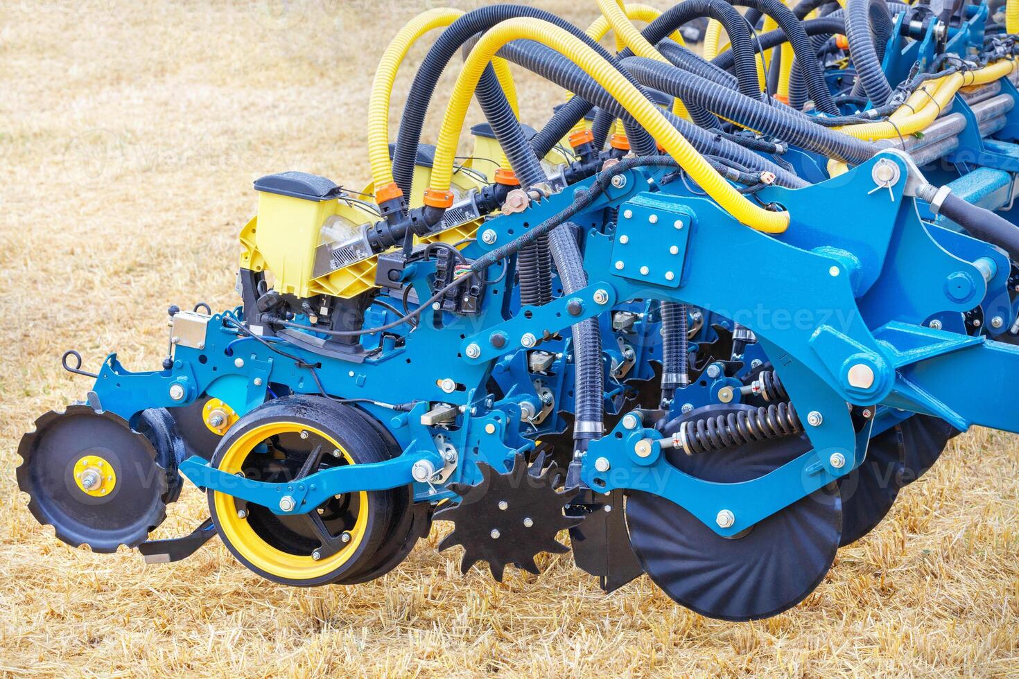 A fragment of a seeder with a mechanism for precise distribution of seeds with a coupling of a multi-row disc harrow. photo