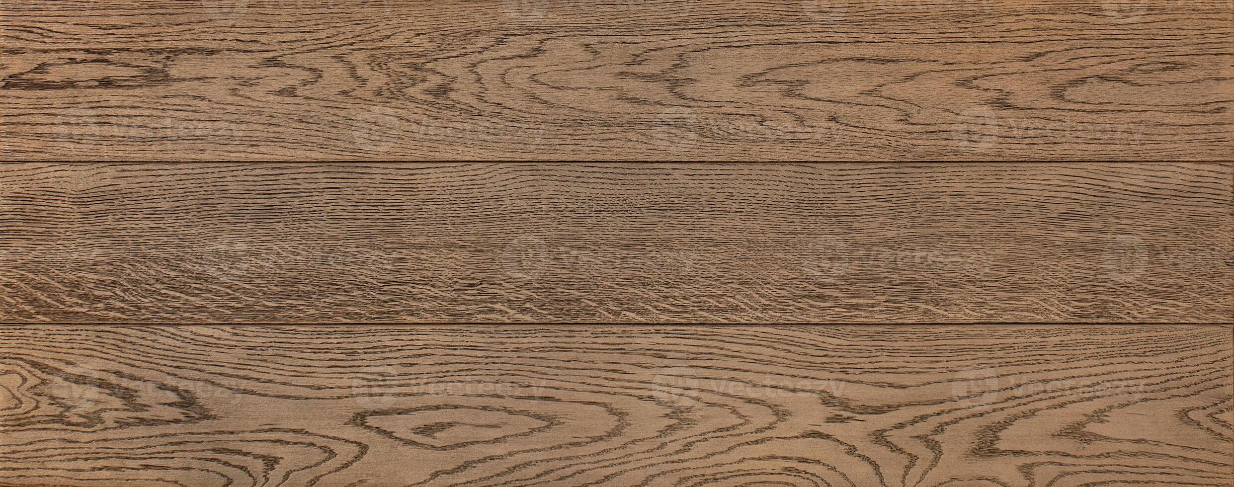 The texture of oak wood planks with a pronounced grain pattern. photo