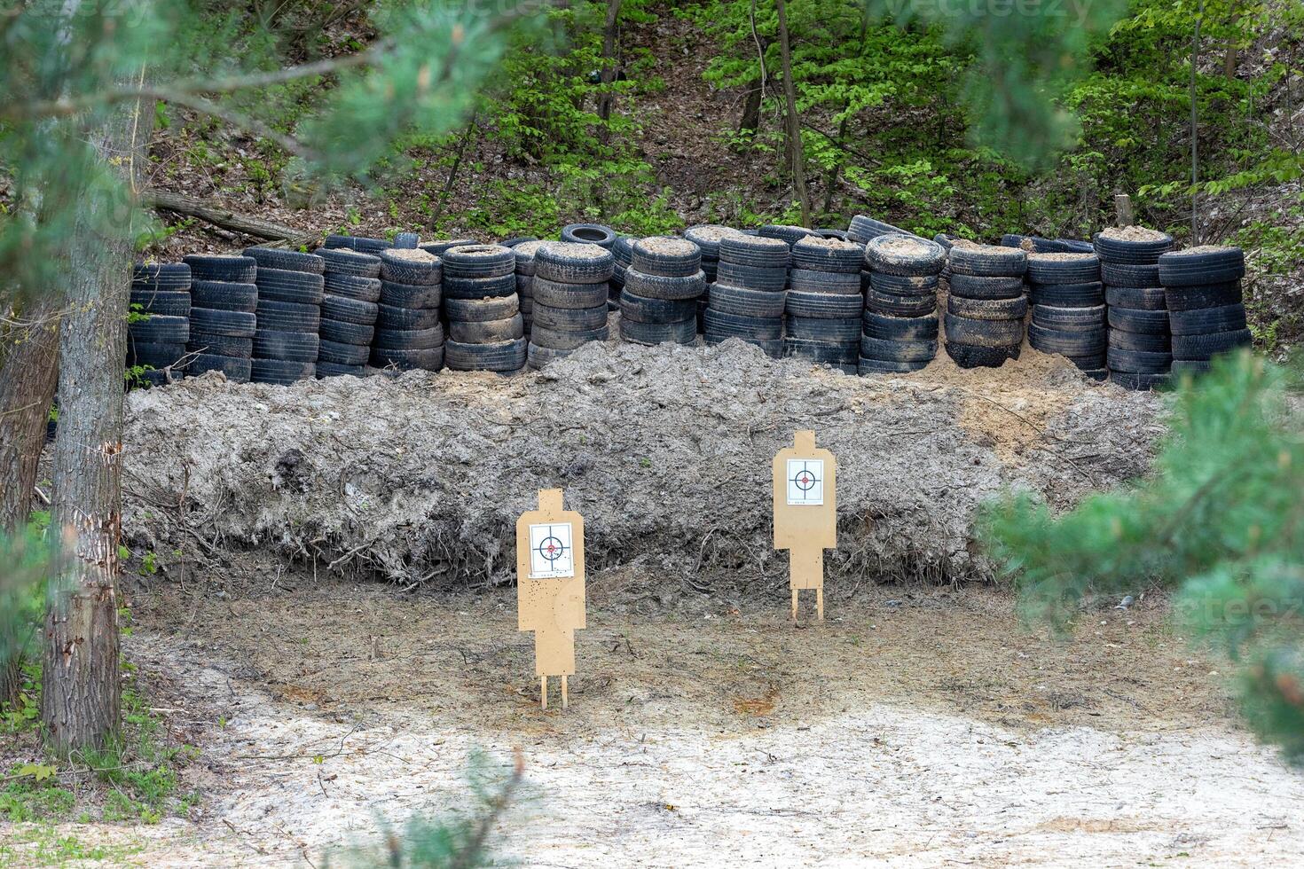 Wooden targets in a shooting range set up in a forest ravine. photo
