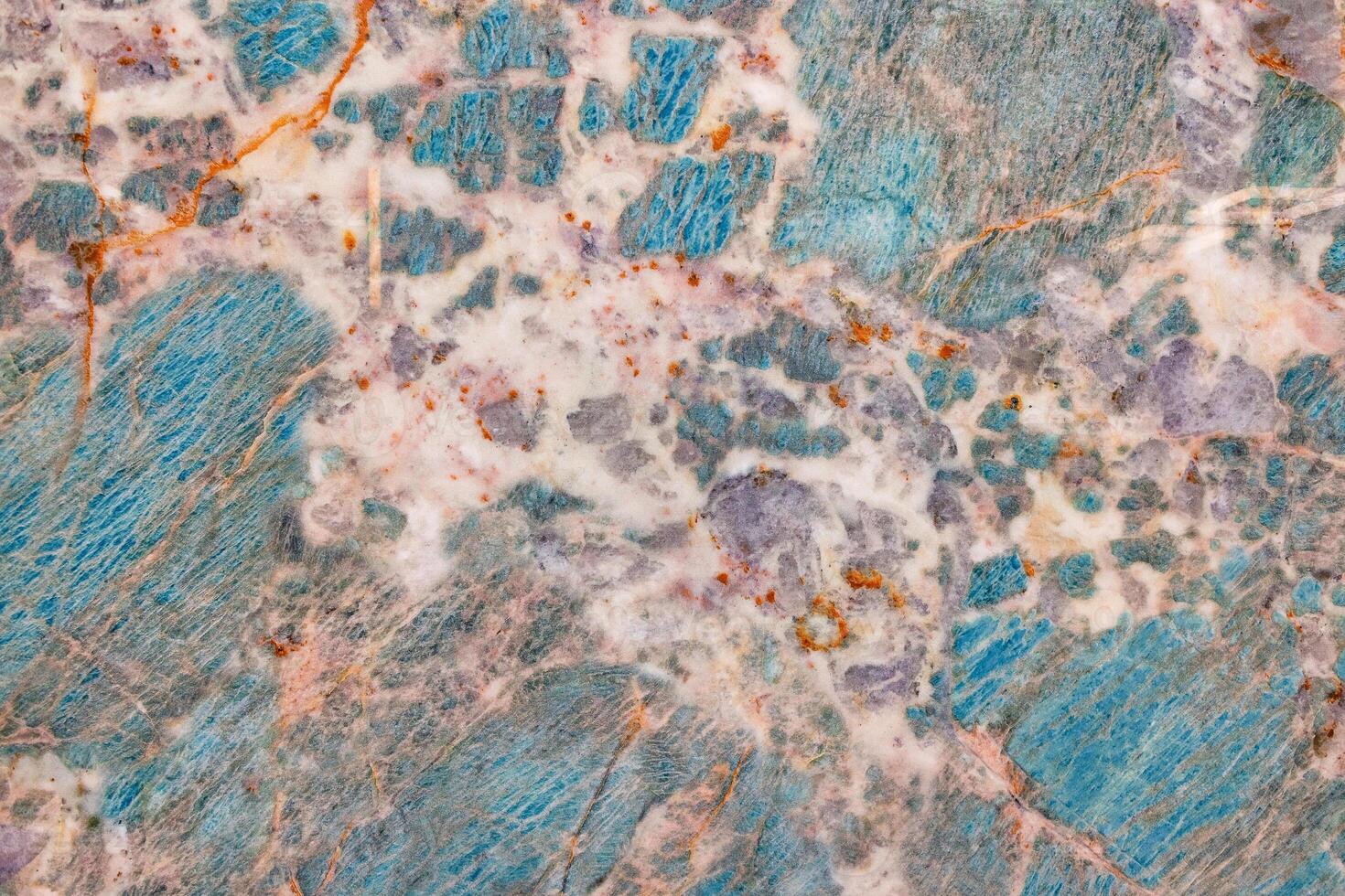 Bright texture of turquoise marble with beige patches and rusty veins. photo