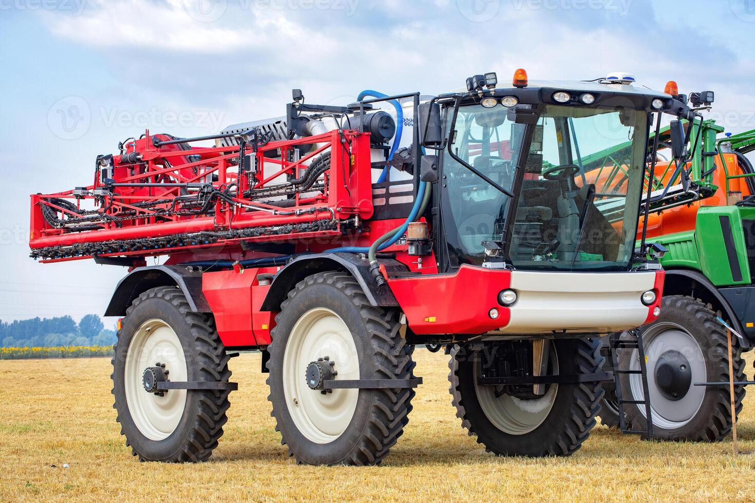 Innovative agricultural machine on a sunny day in a vast farmland, ready for crop protection duties photo