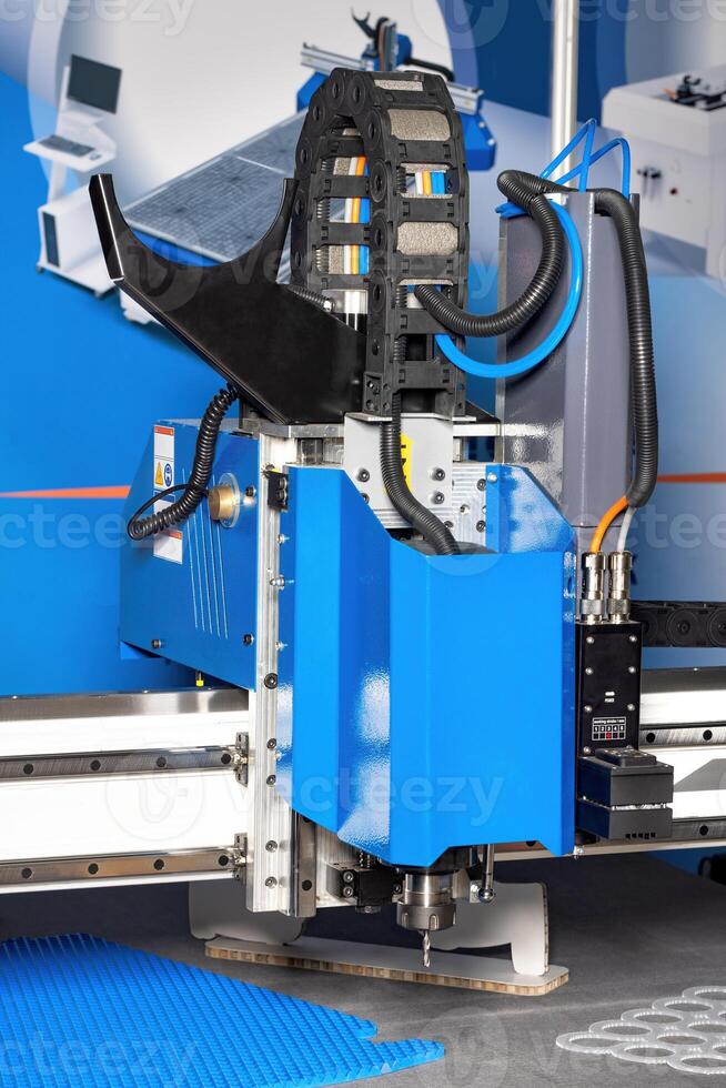 Advanced cutting machine at work in a modern manufacturing facility photo
