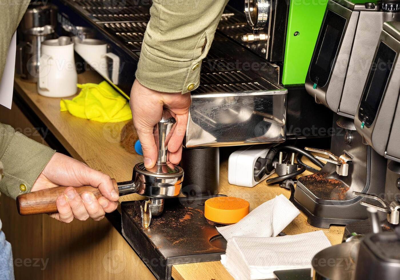 Mastering the art of espresso extraction in a vibrant coffee shop setting photo