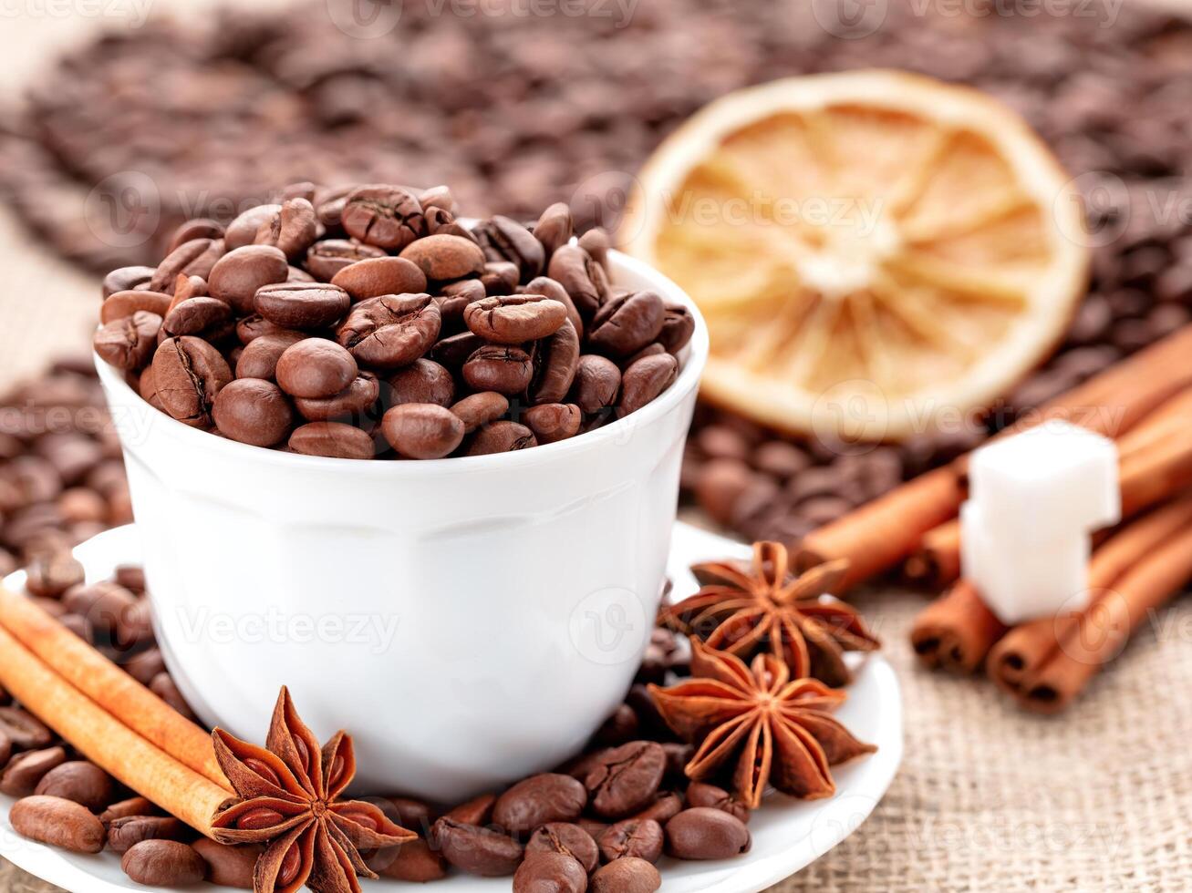 Aromatic coffee blend with spices and citrus garnishing at a cozy setting photo