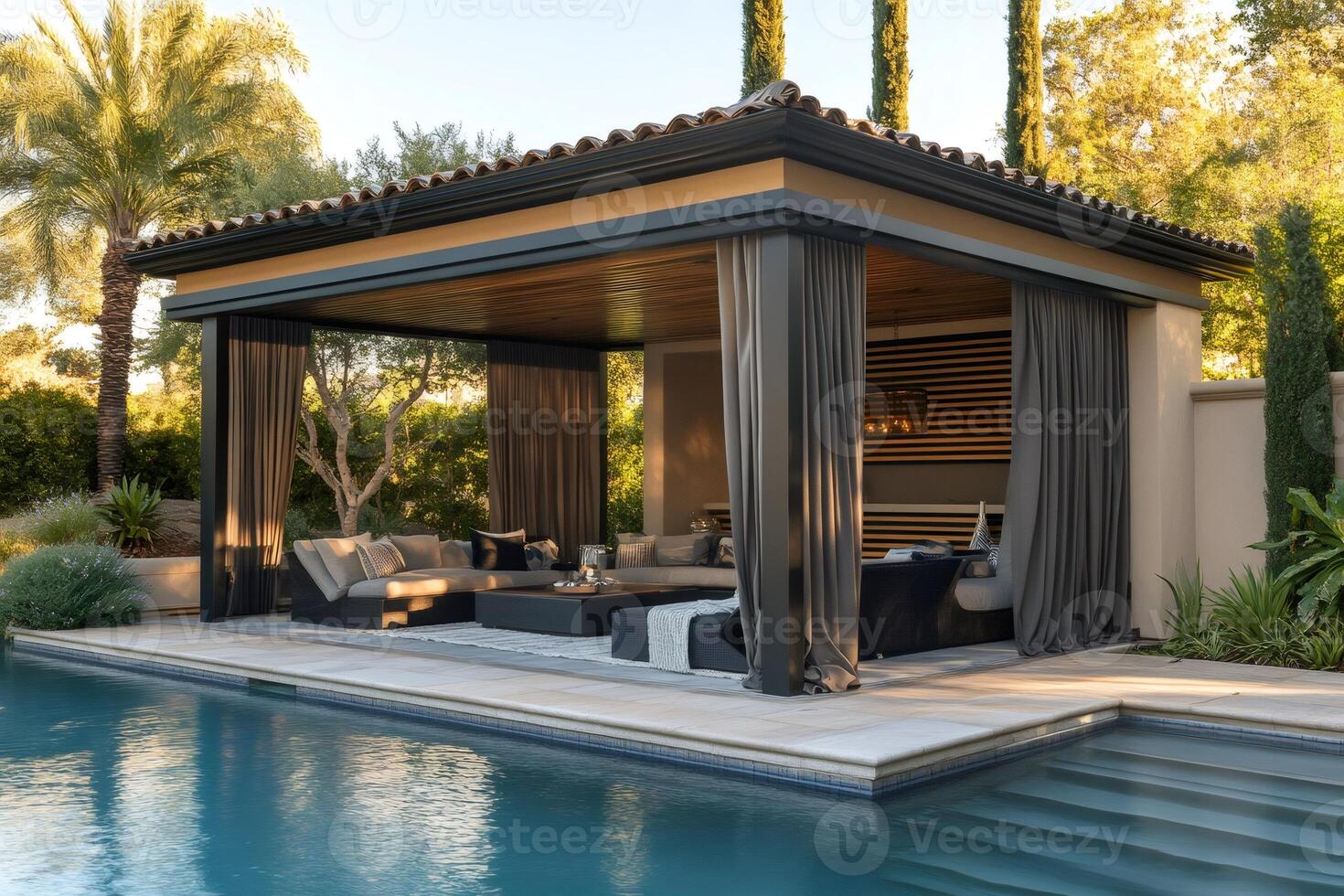 Luxurious gazebo overlooking swimming pool in modern backyard during sunset photo