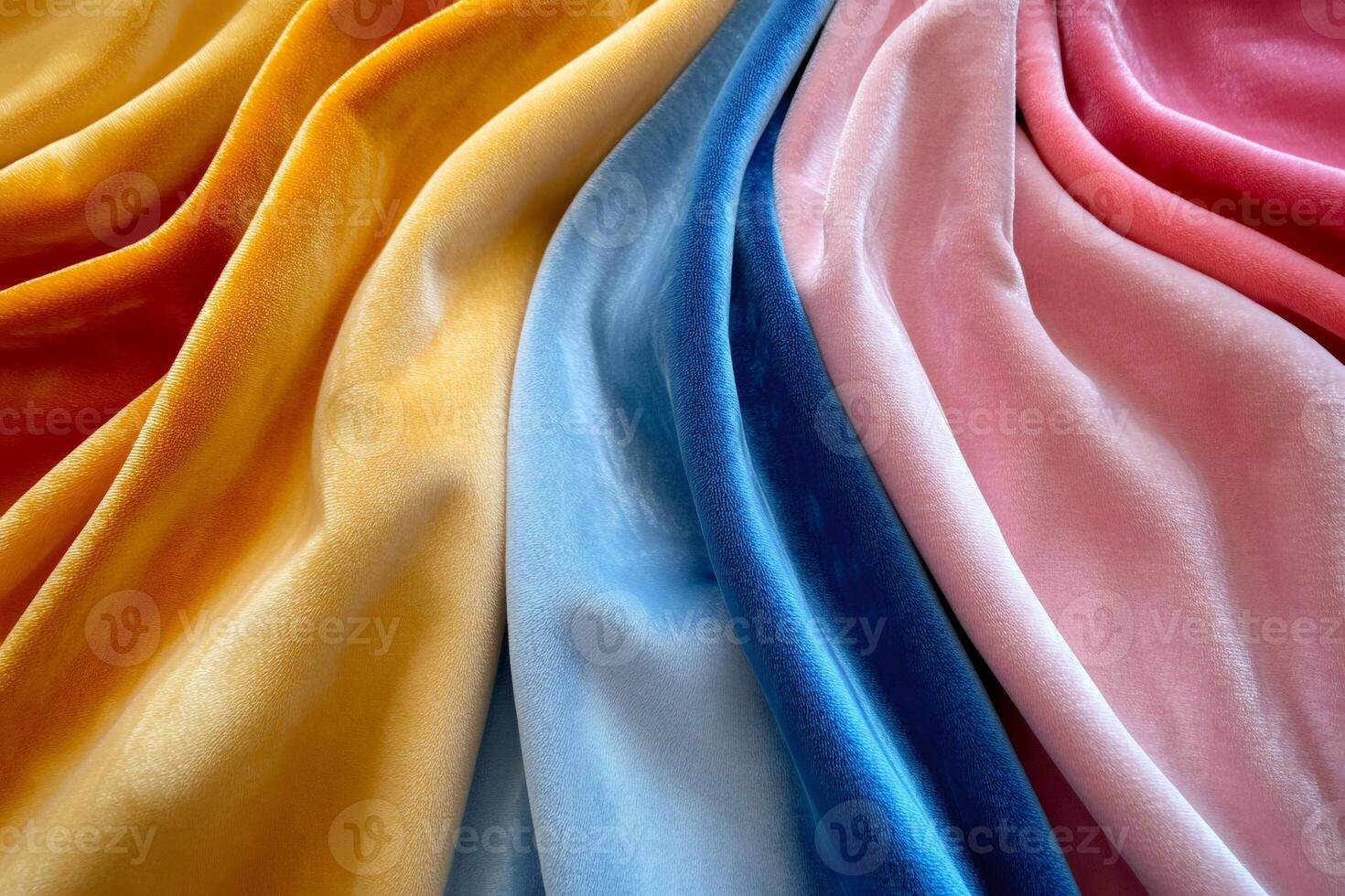 Colorful velvet fabric draped in gentle folds creating luxurious texture photo