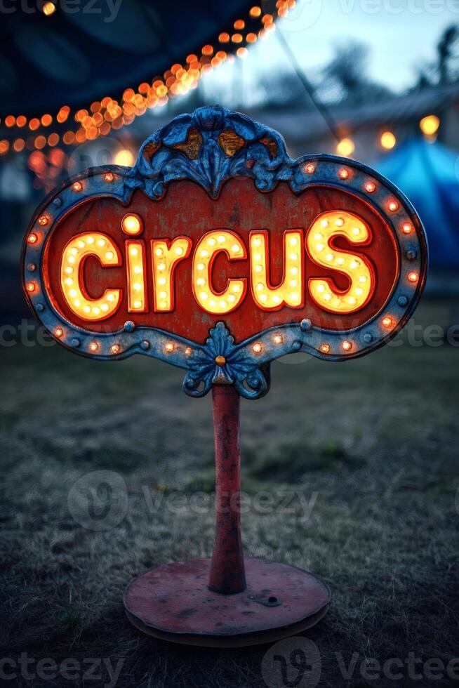 Illuminated circus sign stands in field at dusk, announcing entertainment photo