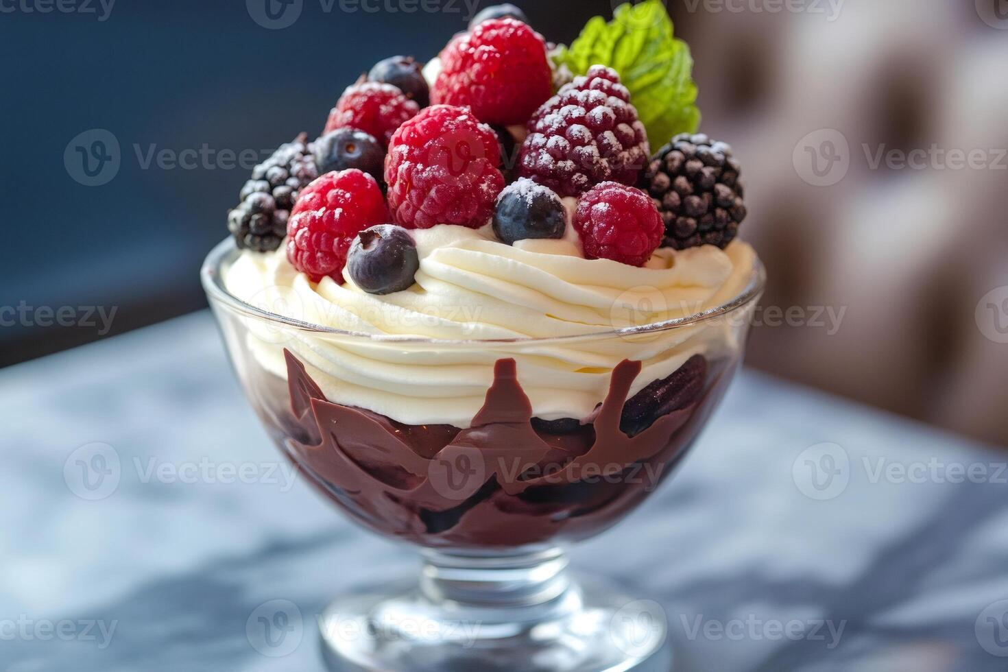 Delicious chocolate mousse dessert with whipped cream and fresh berries photo