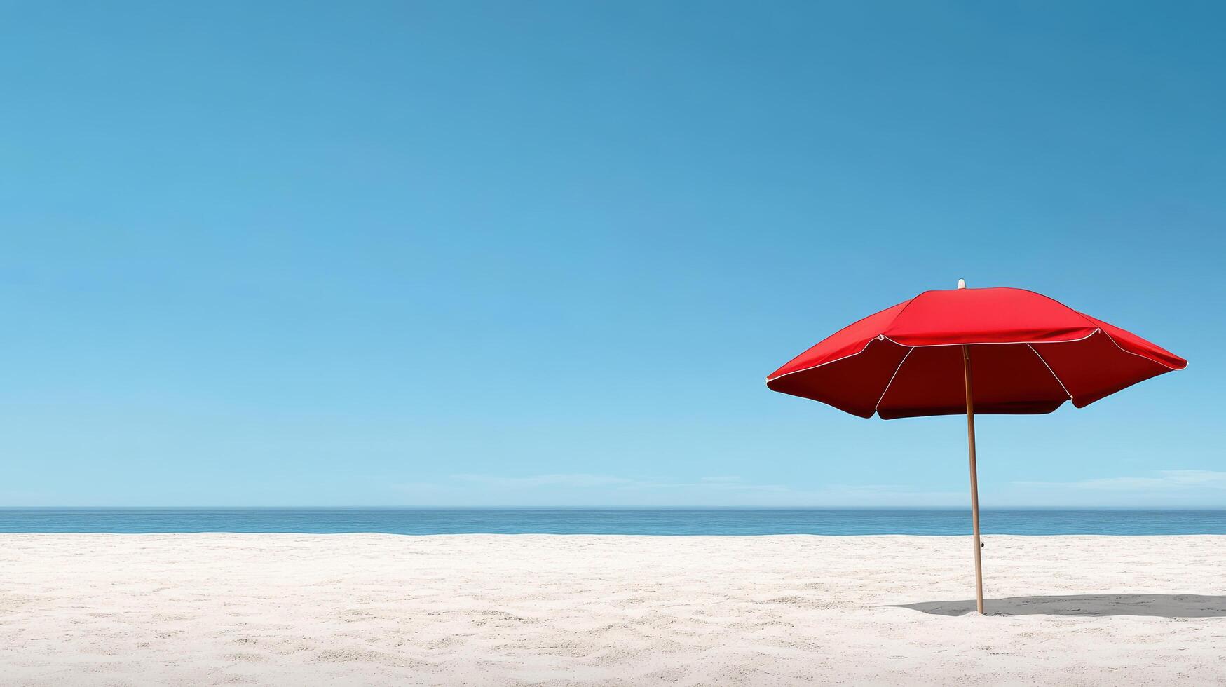 vibrant red umbrella stands on sandy beach under clear blue sky photo