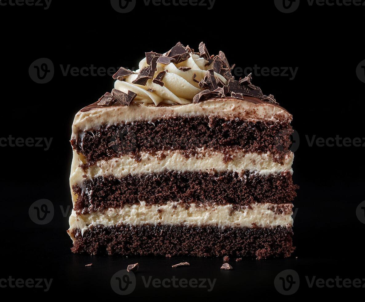 Delicious chocolate cake slice with creamy filling and chocolate shavings photo