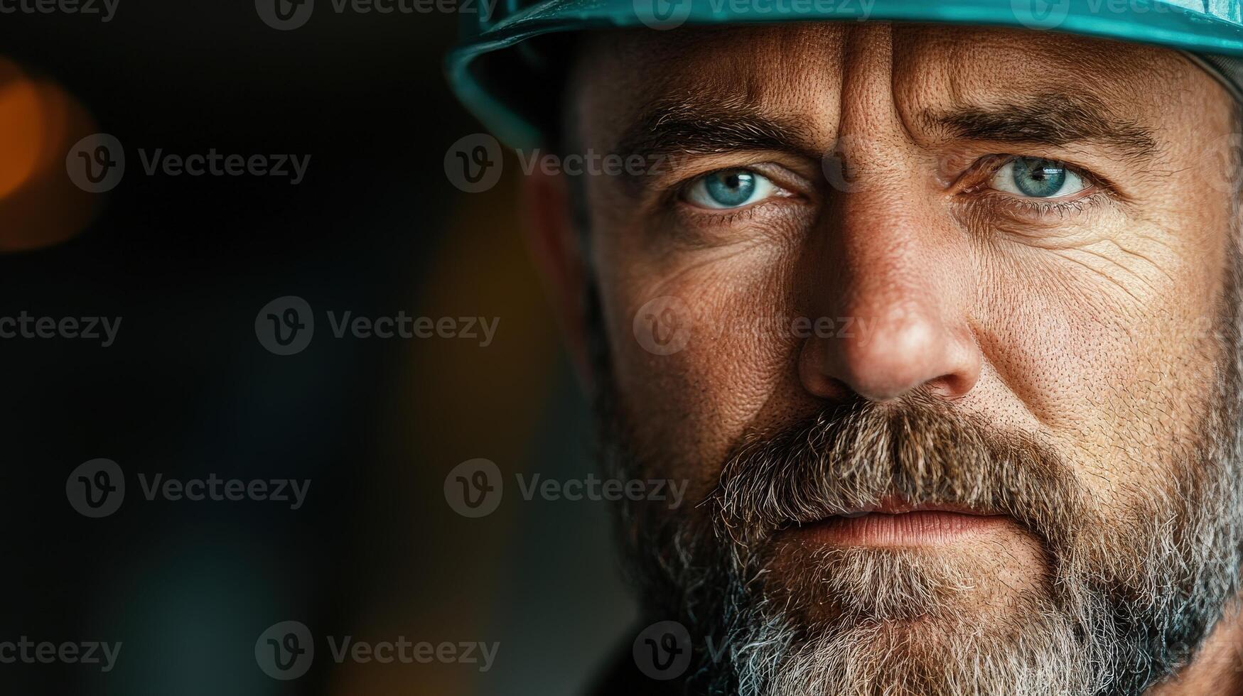 Miner in hard hat with intense gaze showcasing diligence and strength photo
