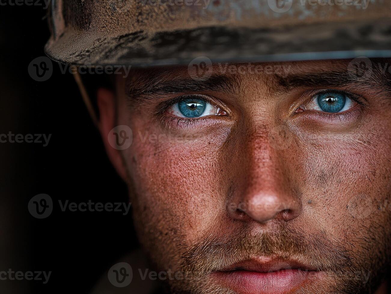 Miner with striking blue eyes showing determination and grit at work site photo