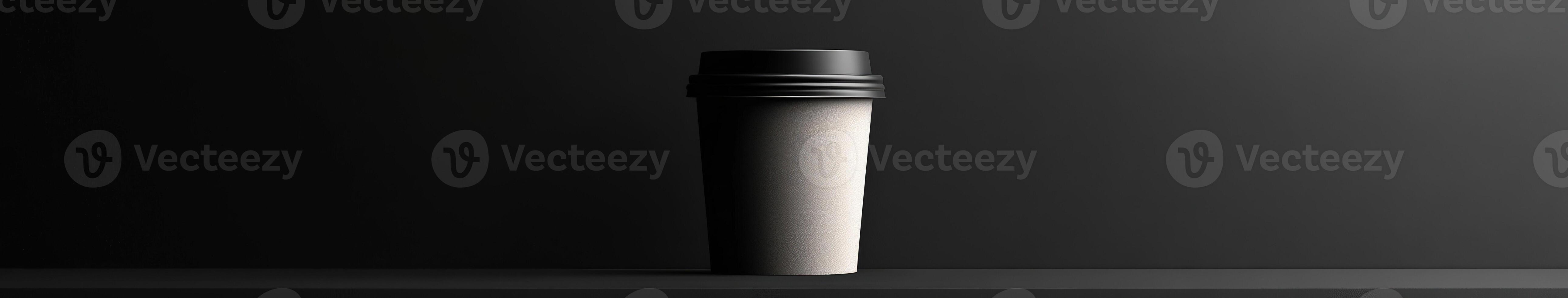 Simple white coffee cup on black background with soft lighting photo