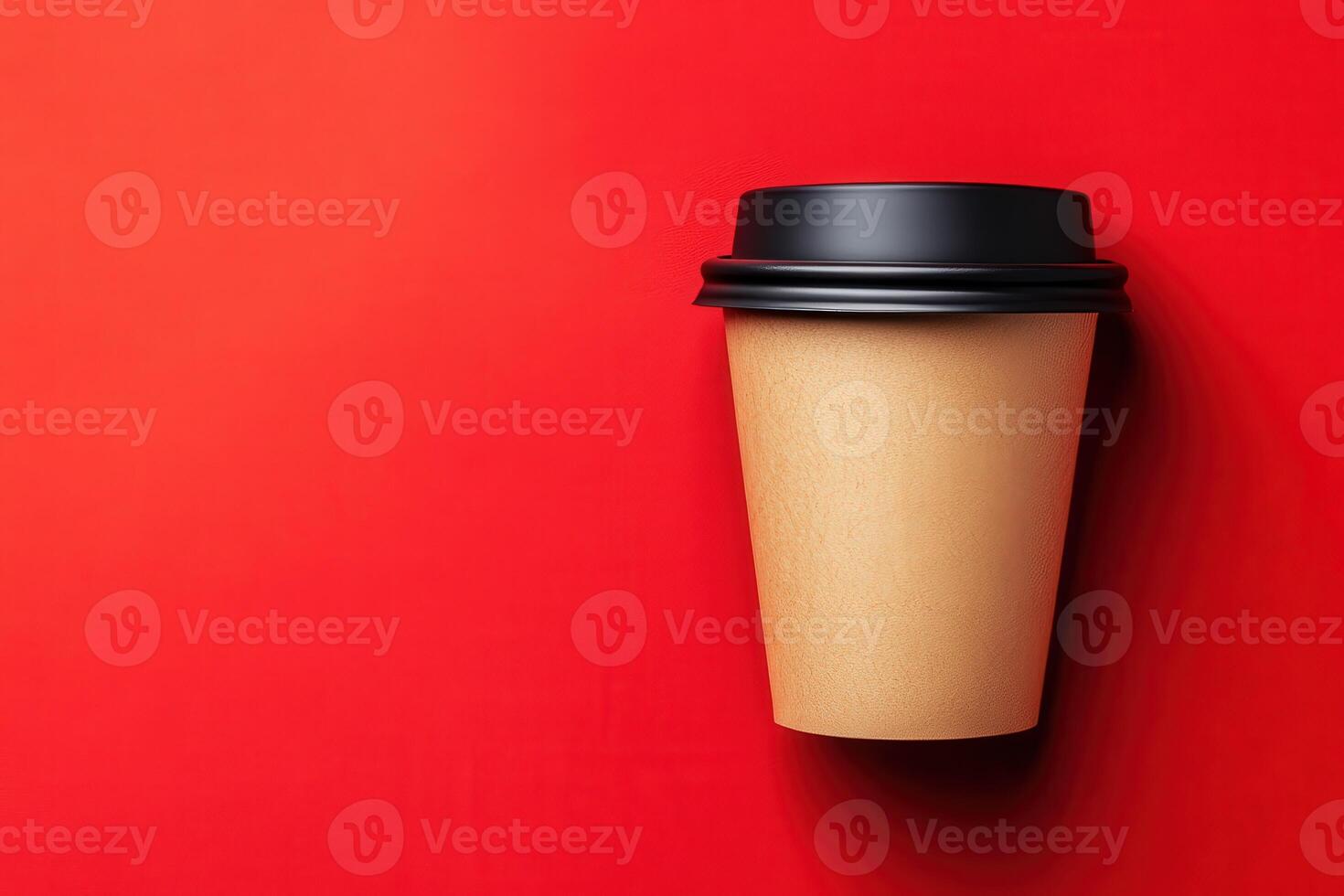 Coffee cup against a vibrant red background with minimalistic design photo