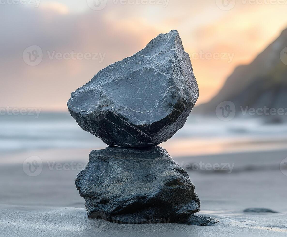 Balancing stones at the beach during a colorful sunset event photo