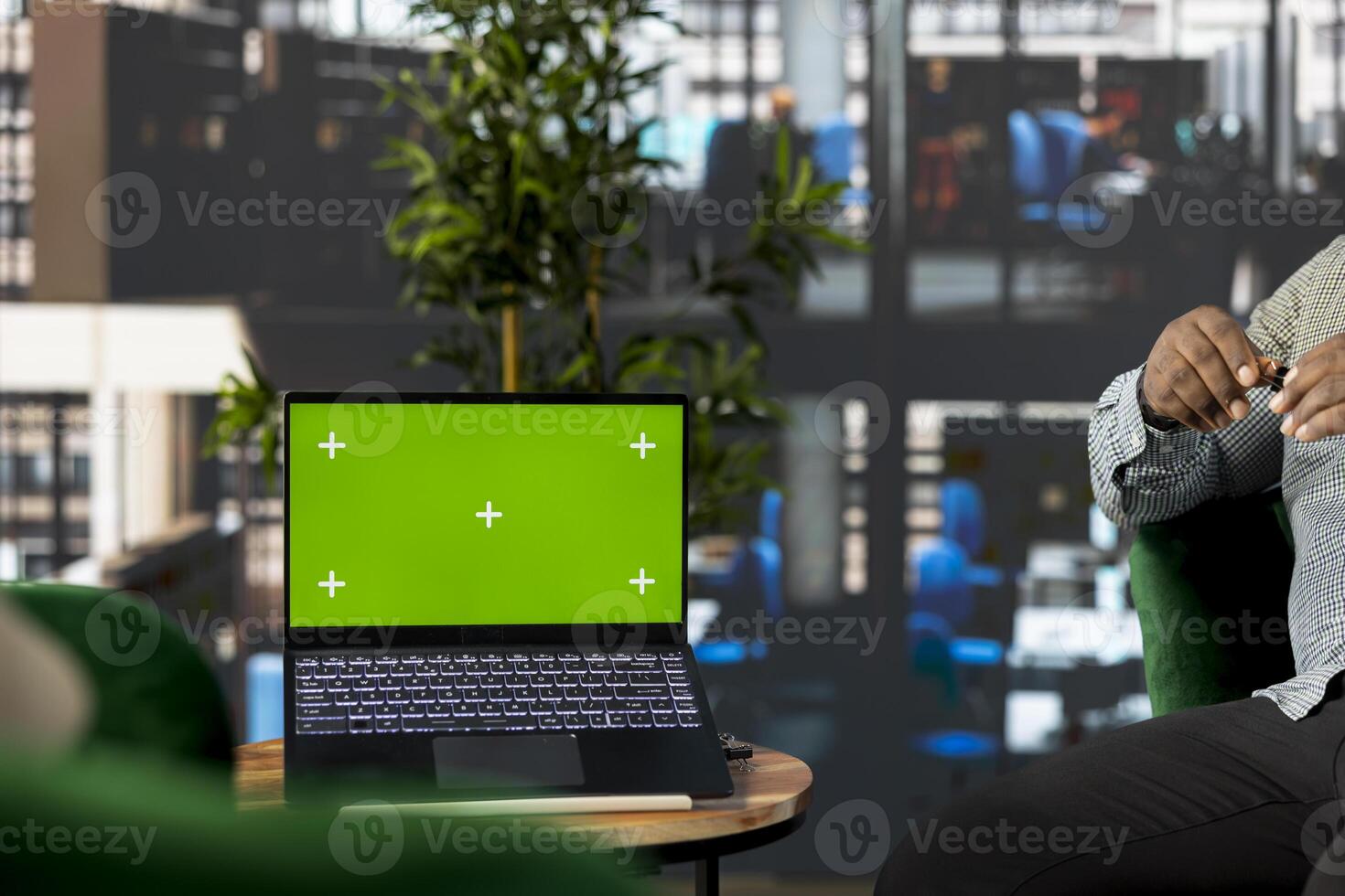 Startup CEO attends meeting to talk about new business vision with executive board member, using green screen laptop. Employee using mockup notebook to pitch investment strategy to manager photo