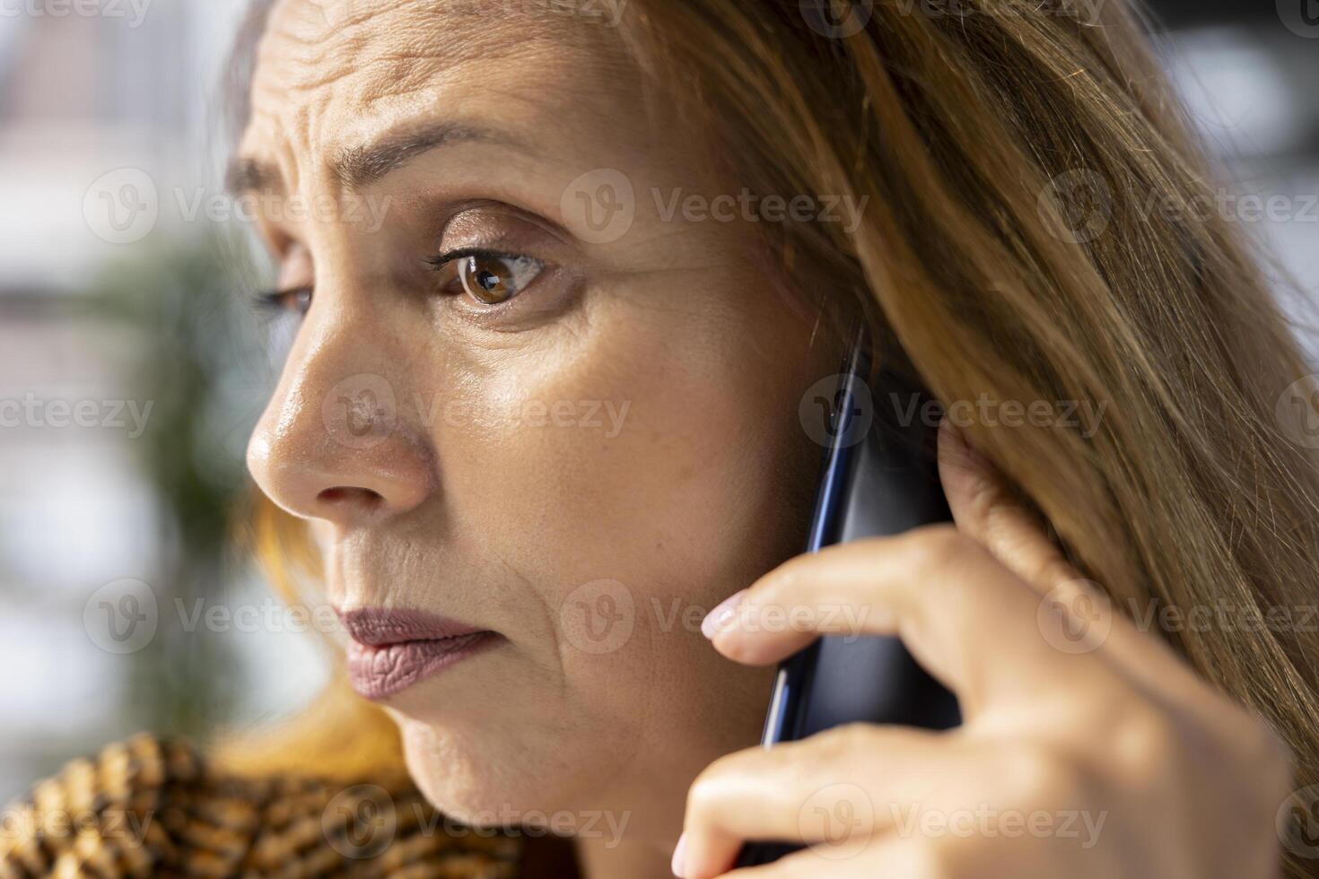 Business executive on a phone call discusses key business tasks, focusing on decision making and budget planning. Manager multitasking business operations and task management efficiently. photo