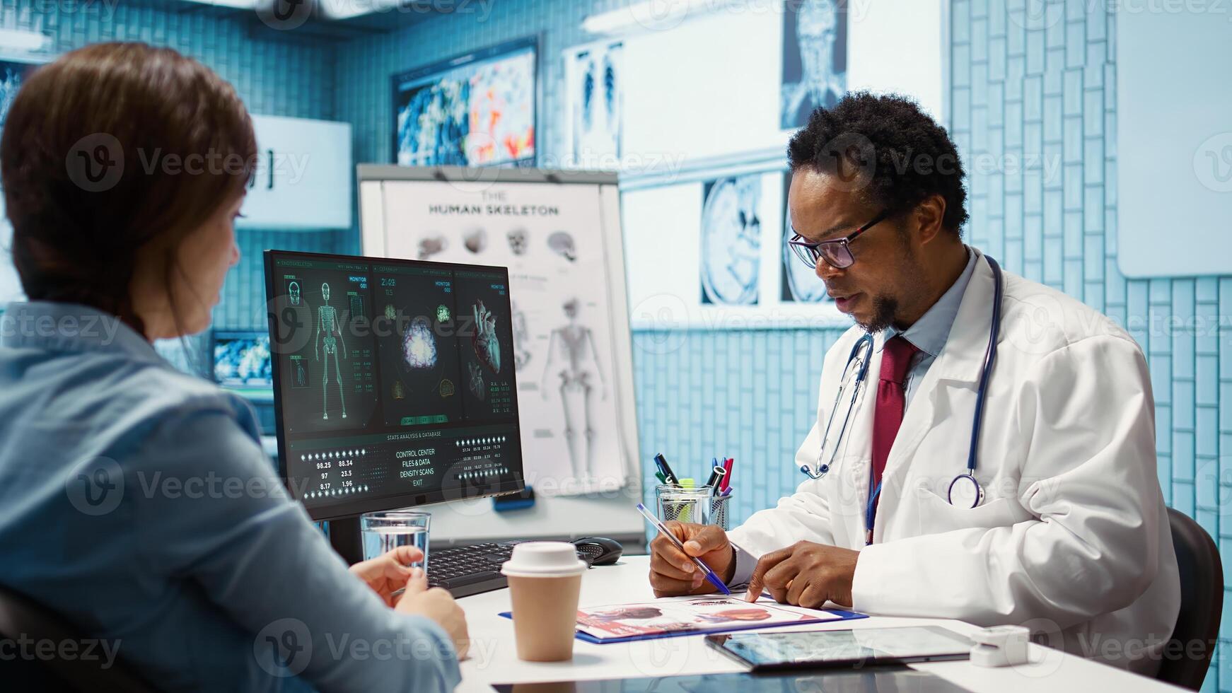 Male physician doing an x ray diagnostics scan interpretation 