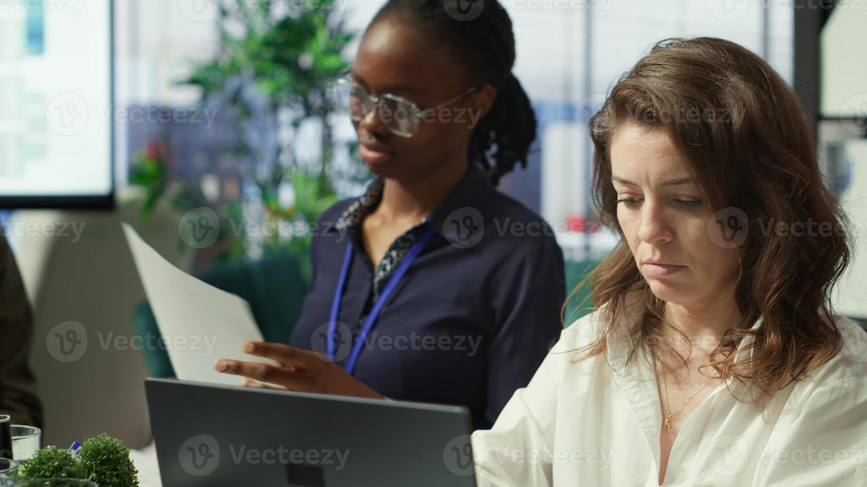 Project leader and her staff conducting a market research for progress plans, learning the trends. Forecast affiliates working on infrastructure investments to fulfill objectives. Camera A. photo