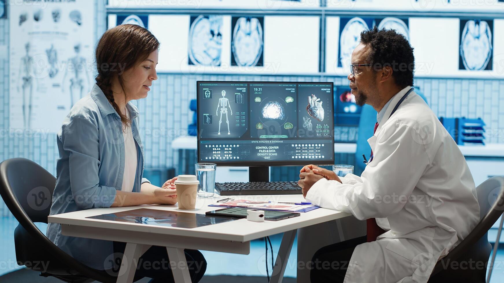 General practitioner giving the right diagnosis to woman patient, attending a checkup consultation in medical cabinet. Doctor explaining x ray imaging and scan results, care management. Camera A. photo