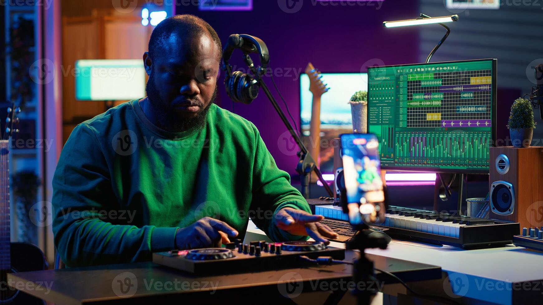 Music producer explaining faders and knobs on mixing console before teaching advanced post production stuff. Musical instructor gives advice about acoustical engineering, online vlog. Camera A. photo