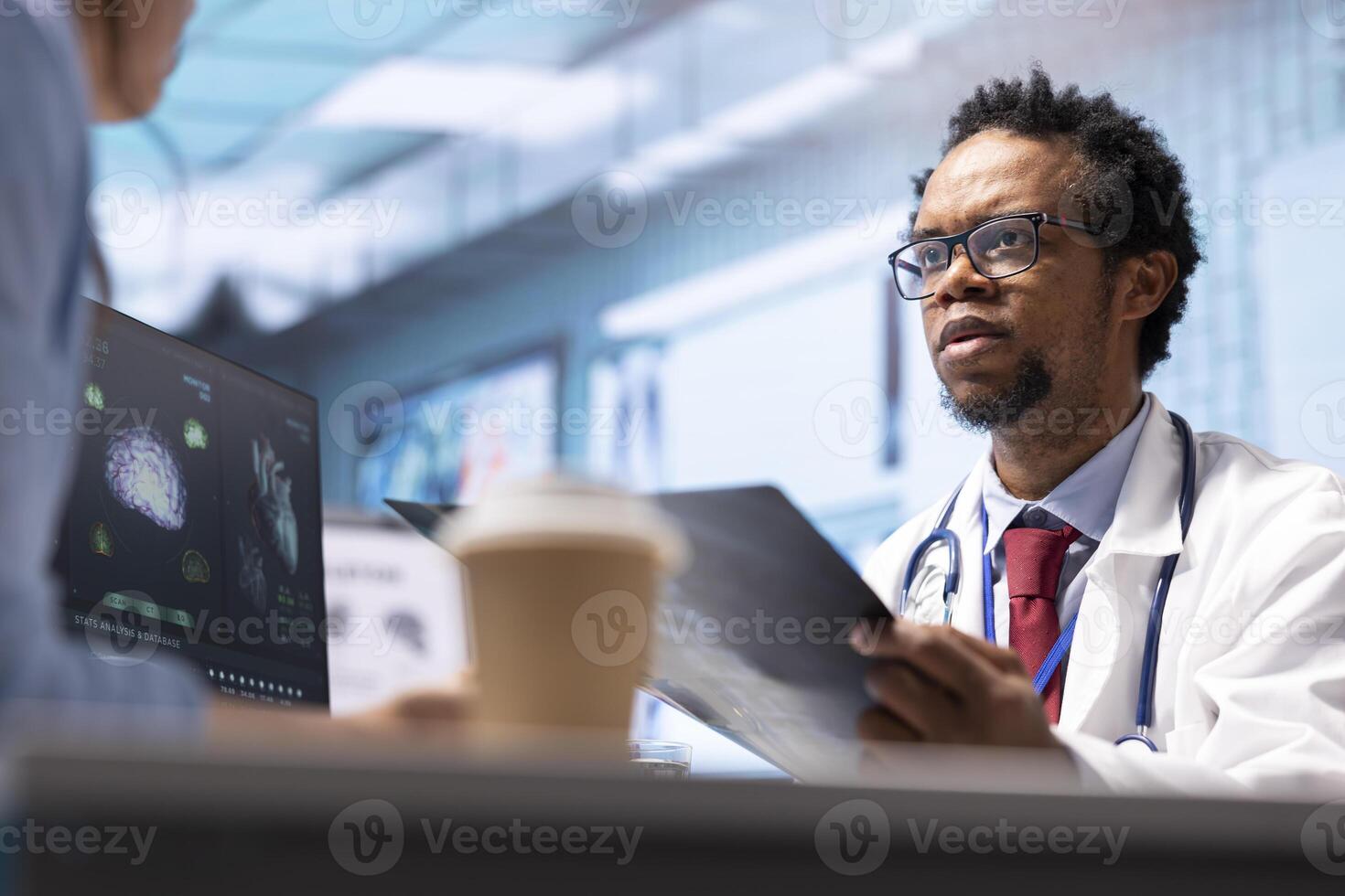 Male physician doing an x ray diagnostics scan interpretation 