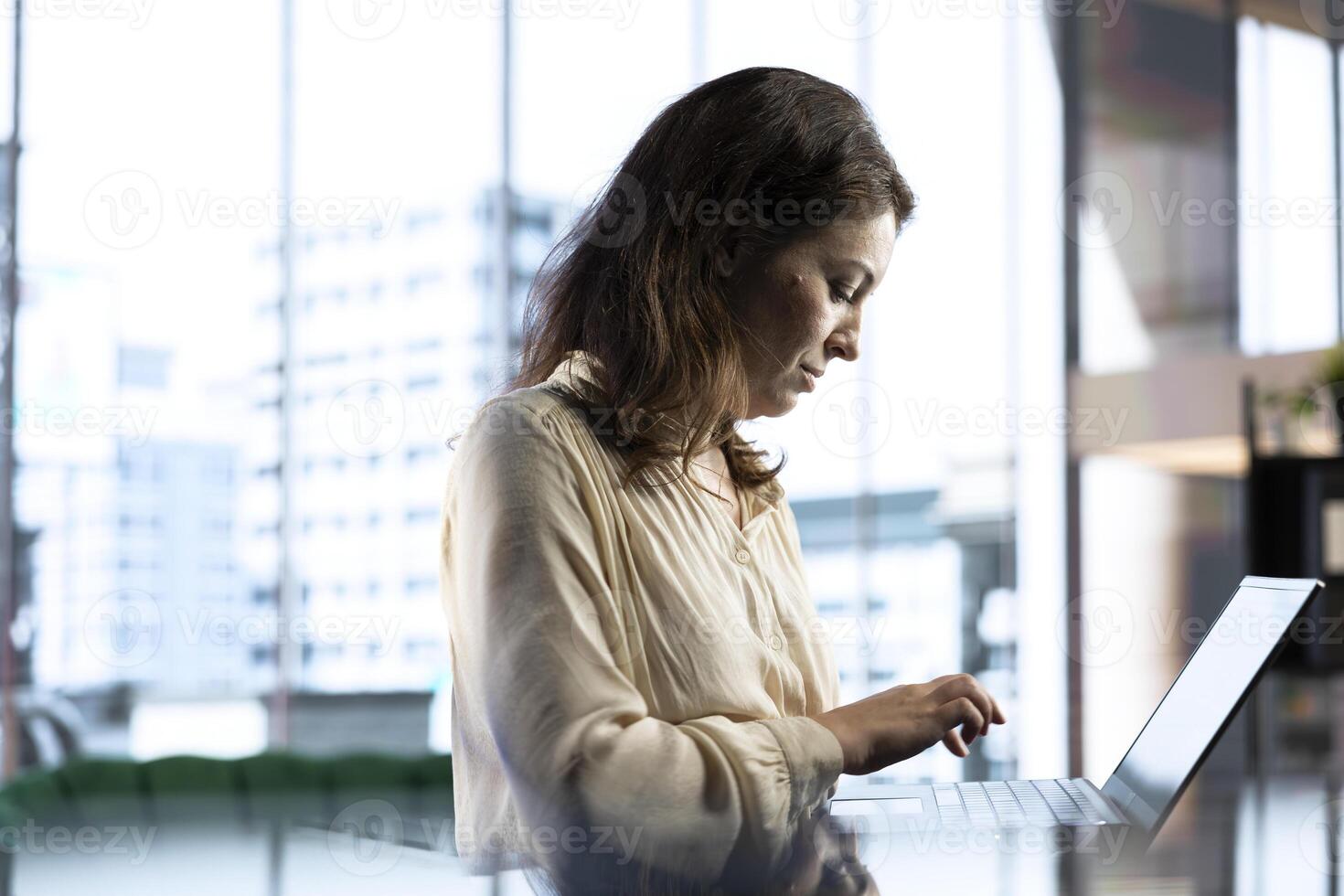 Female CEO leader working on financial planning and budget allocation, ensuring the company resources are used effectively to achieve maximum profit and long term objectives in office. photo