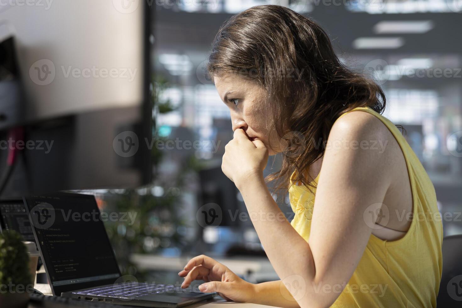 Full stack developer using laptop to create machine learning models that can process and analyze data to automate decision making processes. IT professional programming in office using notebook photo