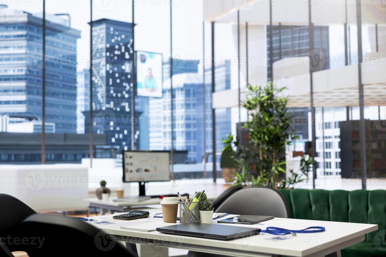 Empty financial department office used for budgeting, forecasting, and financial analysis purposes. Bright modern company workspace with nobody in and devices left open on desks photo