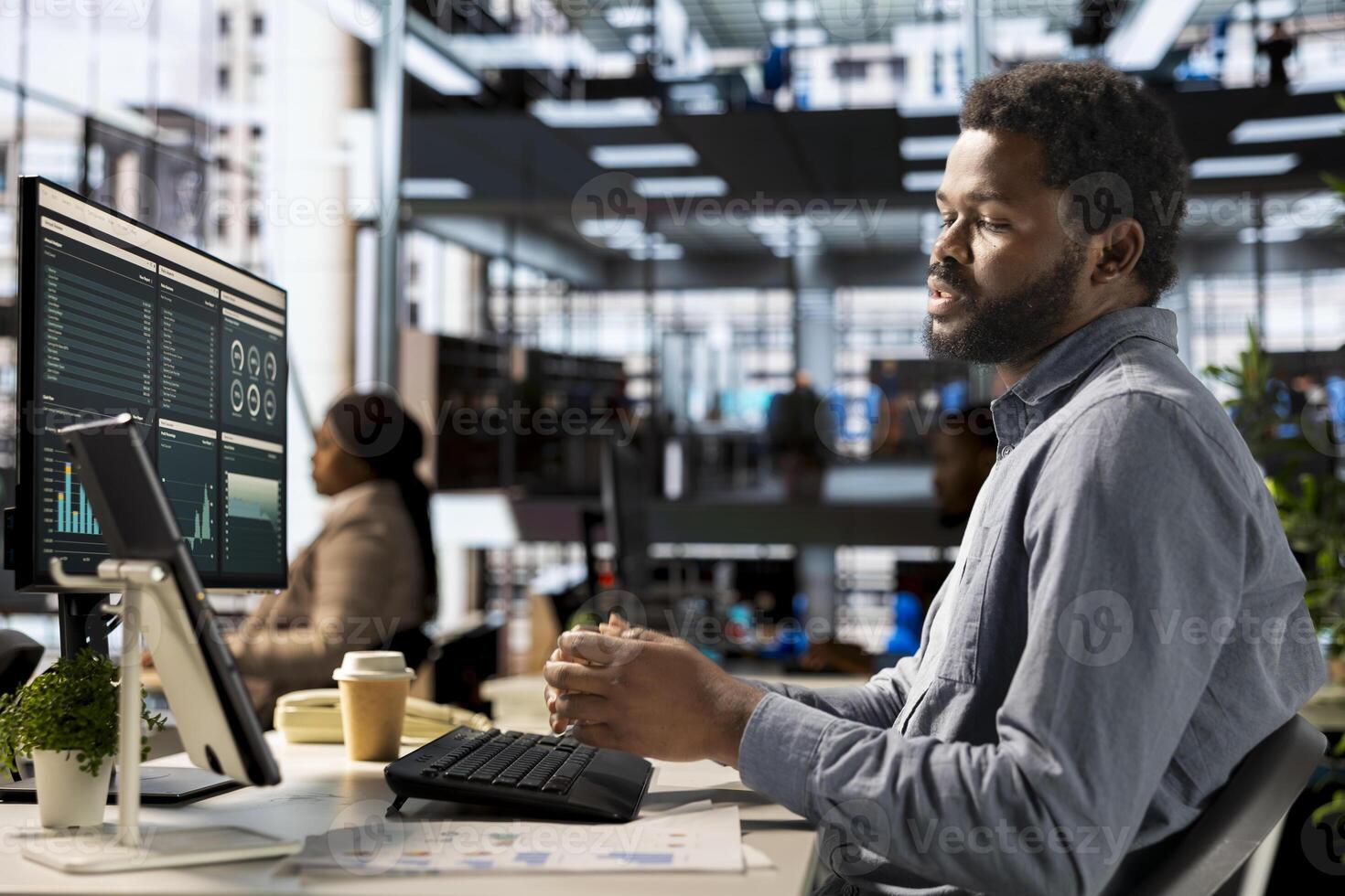 Professional black investor leads a teleconference with his staff, discussing project details and strategic objectives. Virtual chat meeting ensures efficient communication across locations. photo