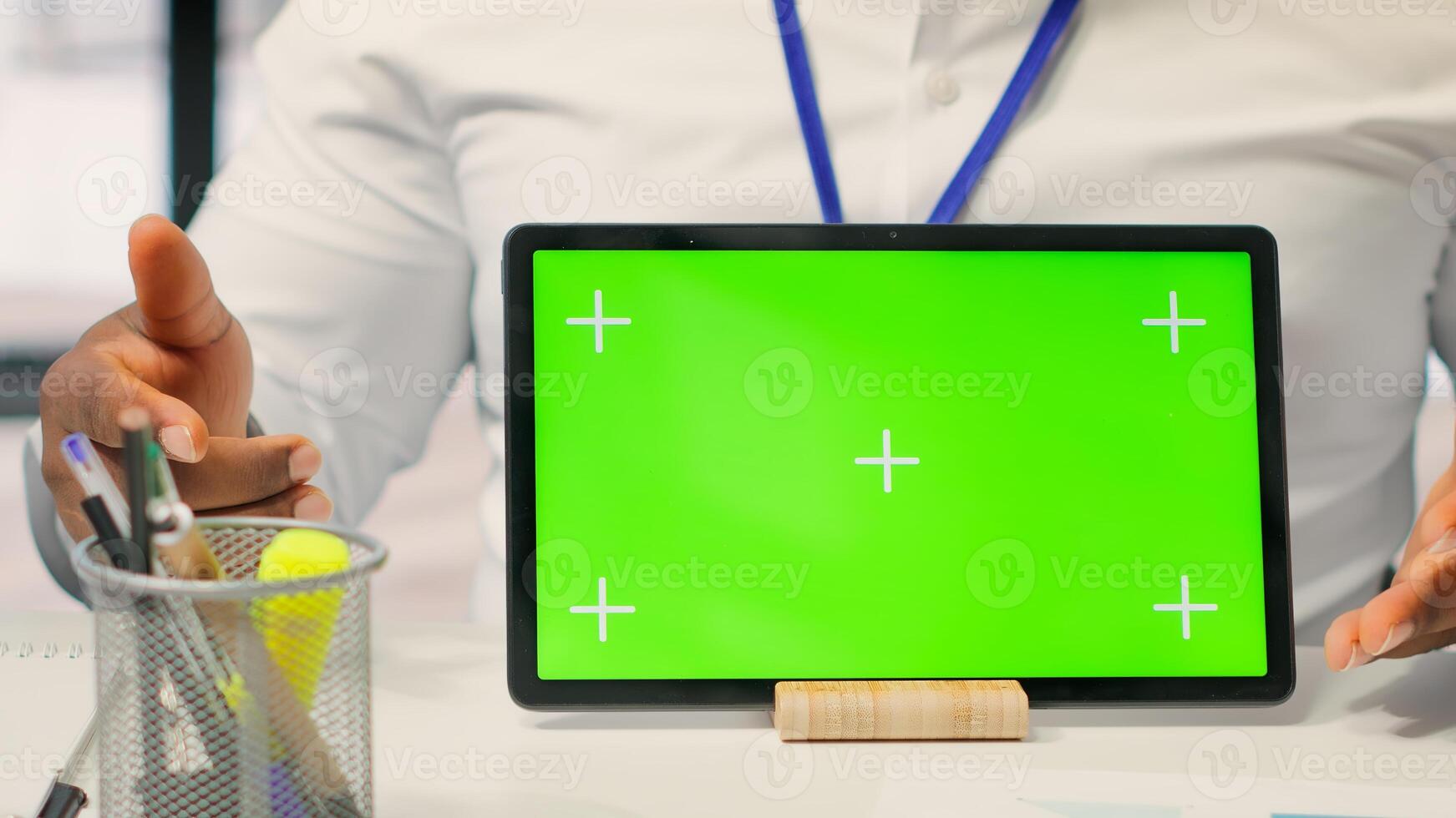 Expert shows tablet with mockup chroma key to mature couple in office, meeting for a counseling session about retirement plan options. Advisor helping senior people with their money. Camera A. photo