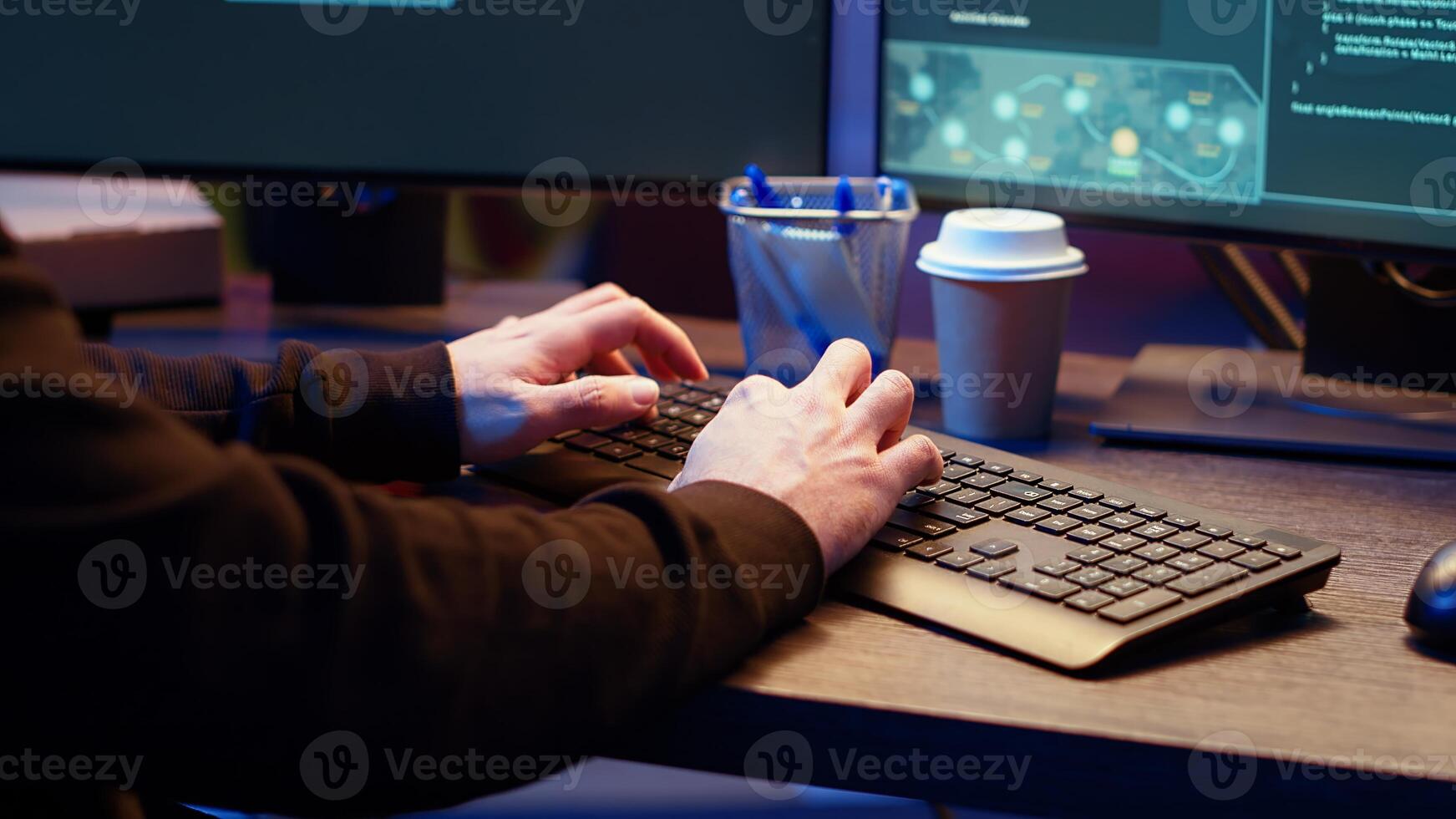 Hackers typing fast on keyboard in graffiti painted hideout, rushing to finish developing spyware software, using it to gather data from users computers without their knowledge, camera B close up photo