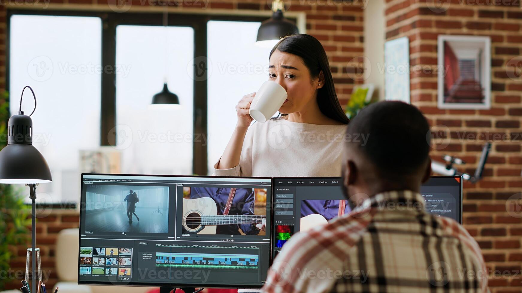Creative team interracial partners collaborating on a editing project, using high end production software for color grading and mixing. Diverse couple uniting forces for work. Camera B. photo
