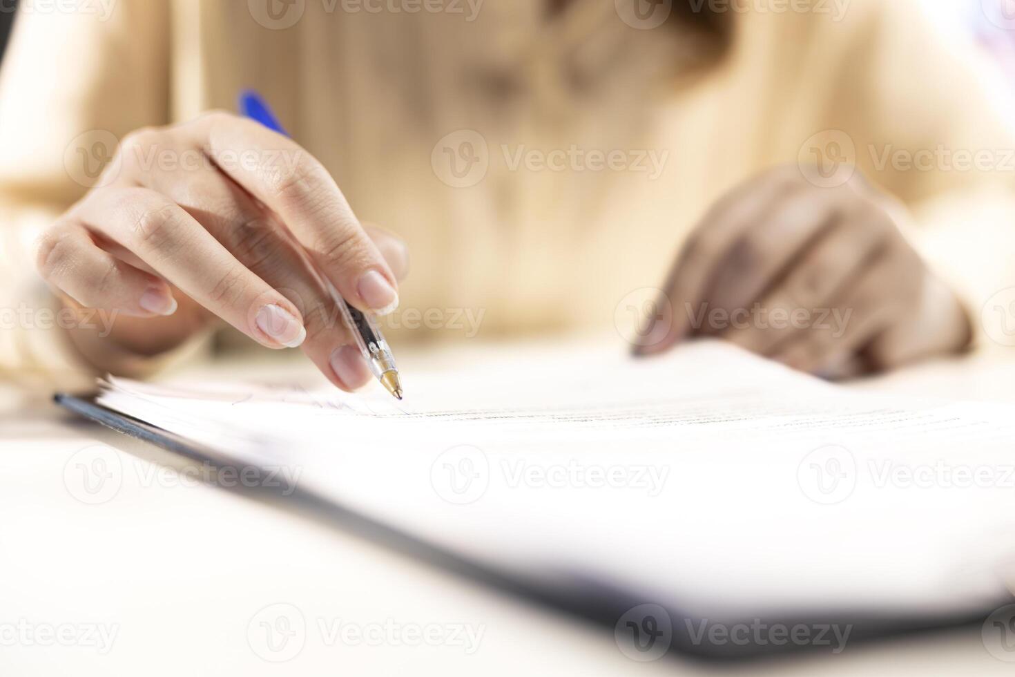 General manager examining contract terms before signing and giving her CEO authorization, ambitious enterprise leader with full authority. Working on legal paperwork management. Close up. photo