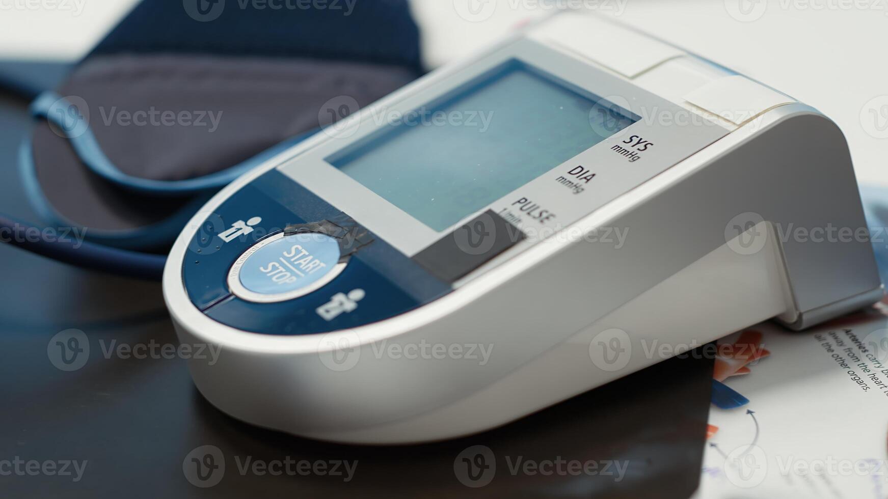 Professional and clean medical office awaiting a patient check up visit, equipped with oximeter, blood pressure monitor and diagnostic tools, emphasizing healthcare services and modern diagnostics. photo