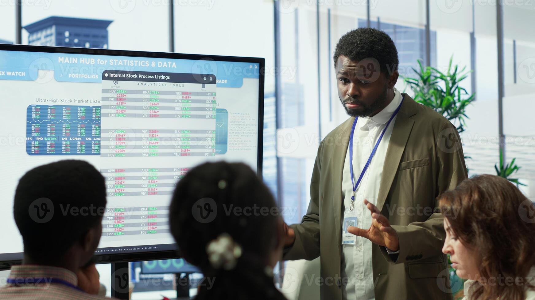 Business professional staff gather to review project development progress, detailed reports and statistics on interactive board to ensure strategic objectives. Diverse work team in meeting. Camera A. photo