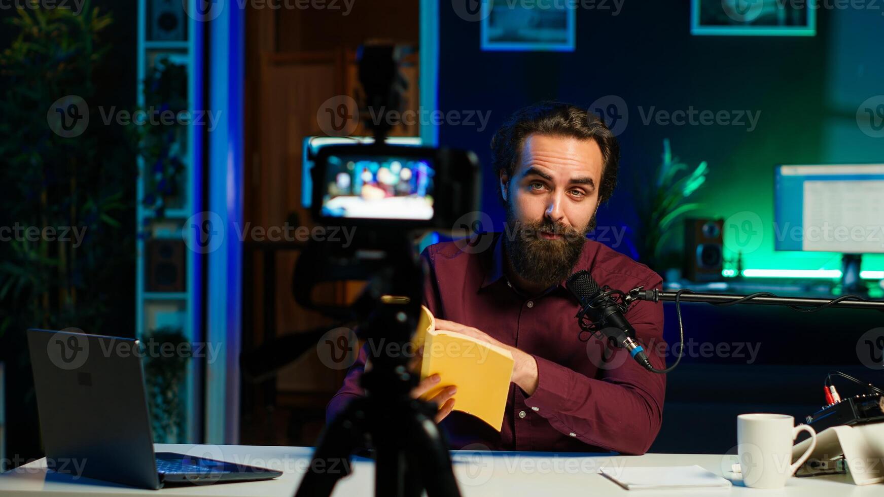 Online show host reading and recommending best reviewed books of the year. Content creator in studio doing novel summaries for interested readers, speaking in professional mic, camera A photo