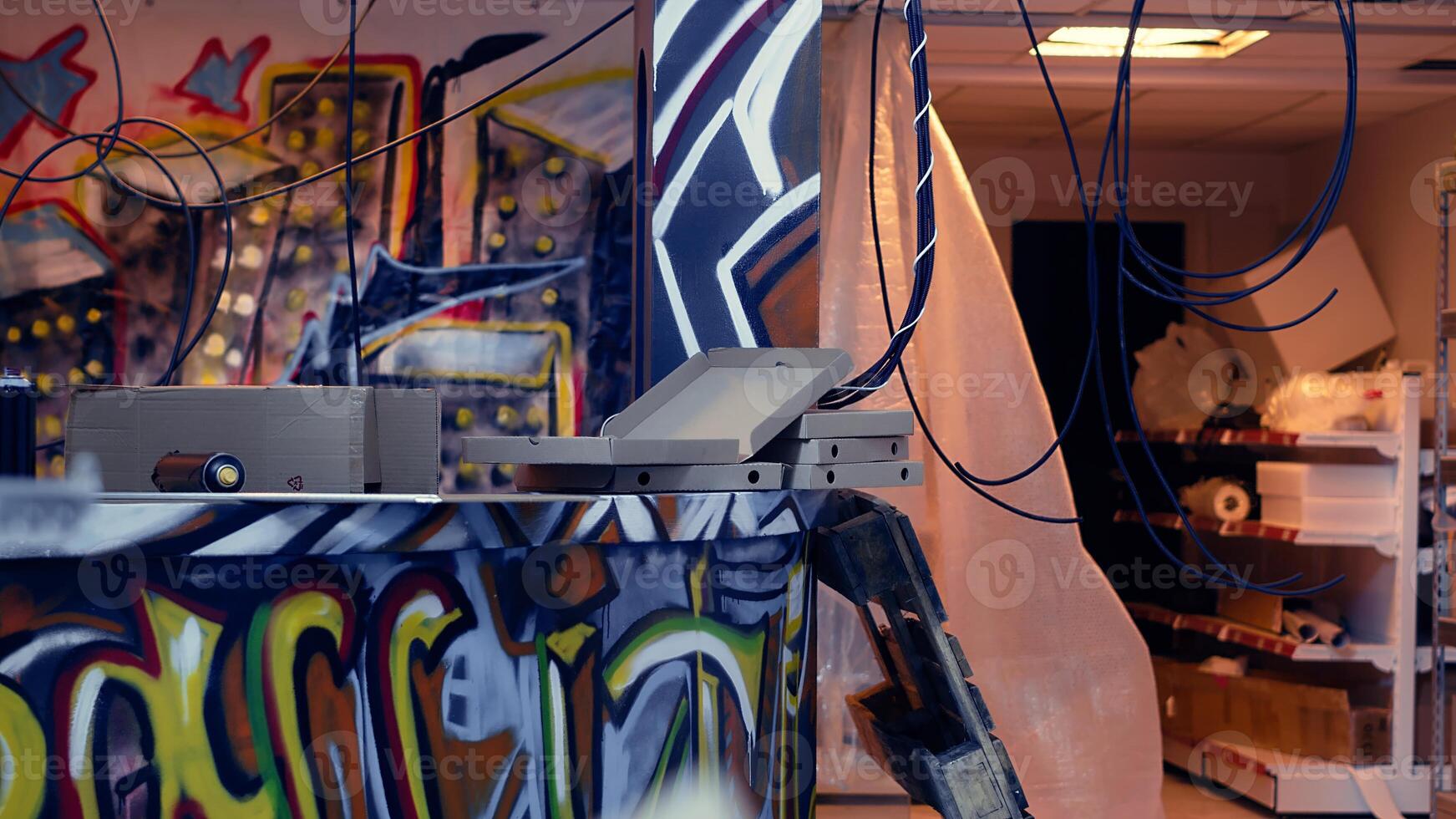 Subversive graffiti art on walls in derelict building, concept of counterculture lifestyle. Old building used as headquarters by teenagers doing civil disobedience, panning shot photo