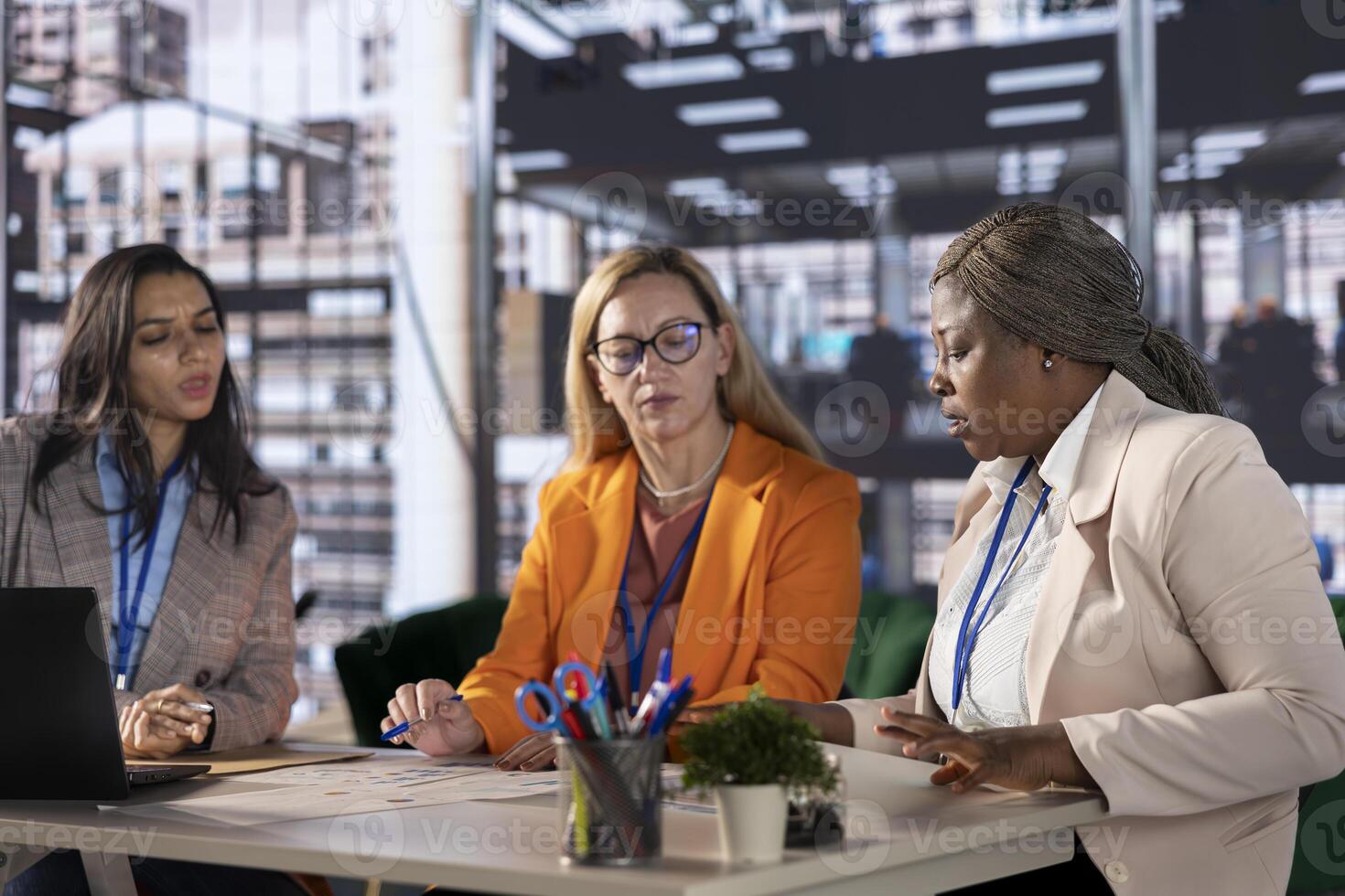 Corporate leaders demonstrating powerful collaboration and strategic thinking, share insights and big ideas in a briefing meeting. Women strategizing for growth fostering diversity and innovation. photo