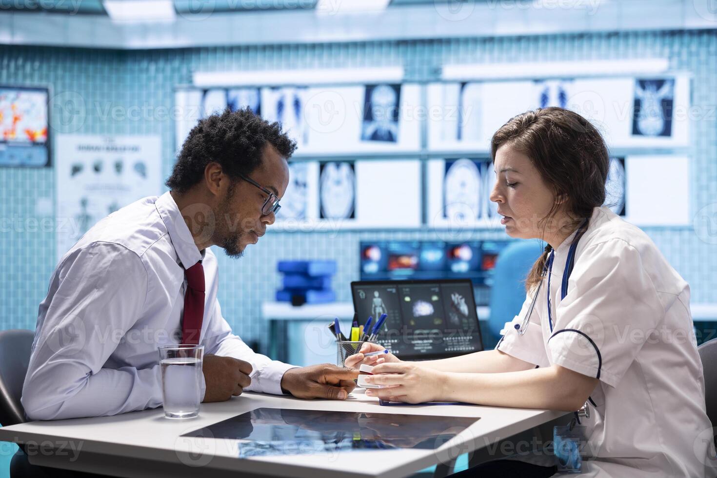 Healthcare professional uses an oximeter to measure the oxygen levels for a patient at check up, diagnostic tools for accurate medical advice. Monitoring pulse and saturation with indicator. photo
