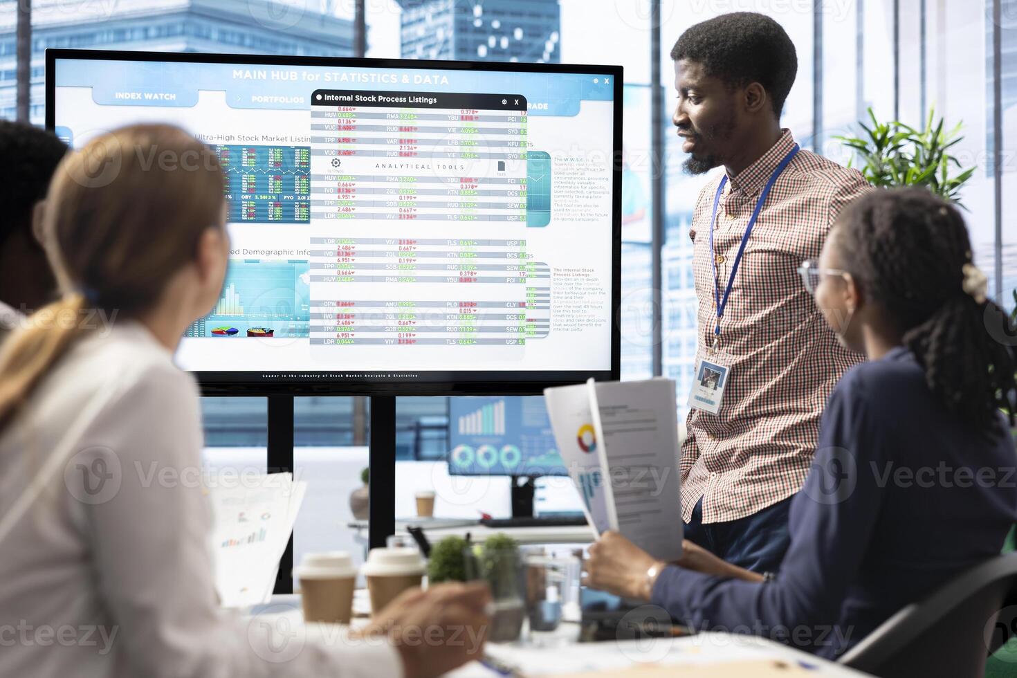Company workers in a high end office space collaborating on project management tasks, utilizing digital tools to enhance workflow and productivity. Reviewing big data on interactive board. photo