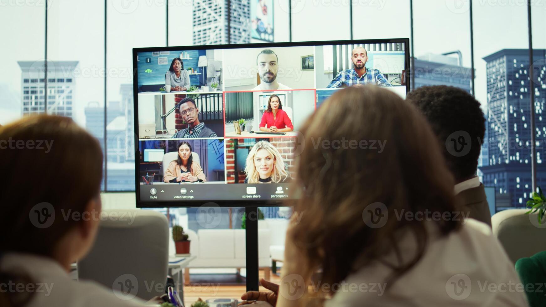 General manager starts a meeting on online videoconference call in the boardroom, discussing about updates with his staff. Business associates reviewing financial planning for growth. Camera B. photo
