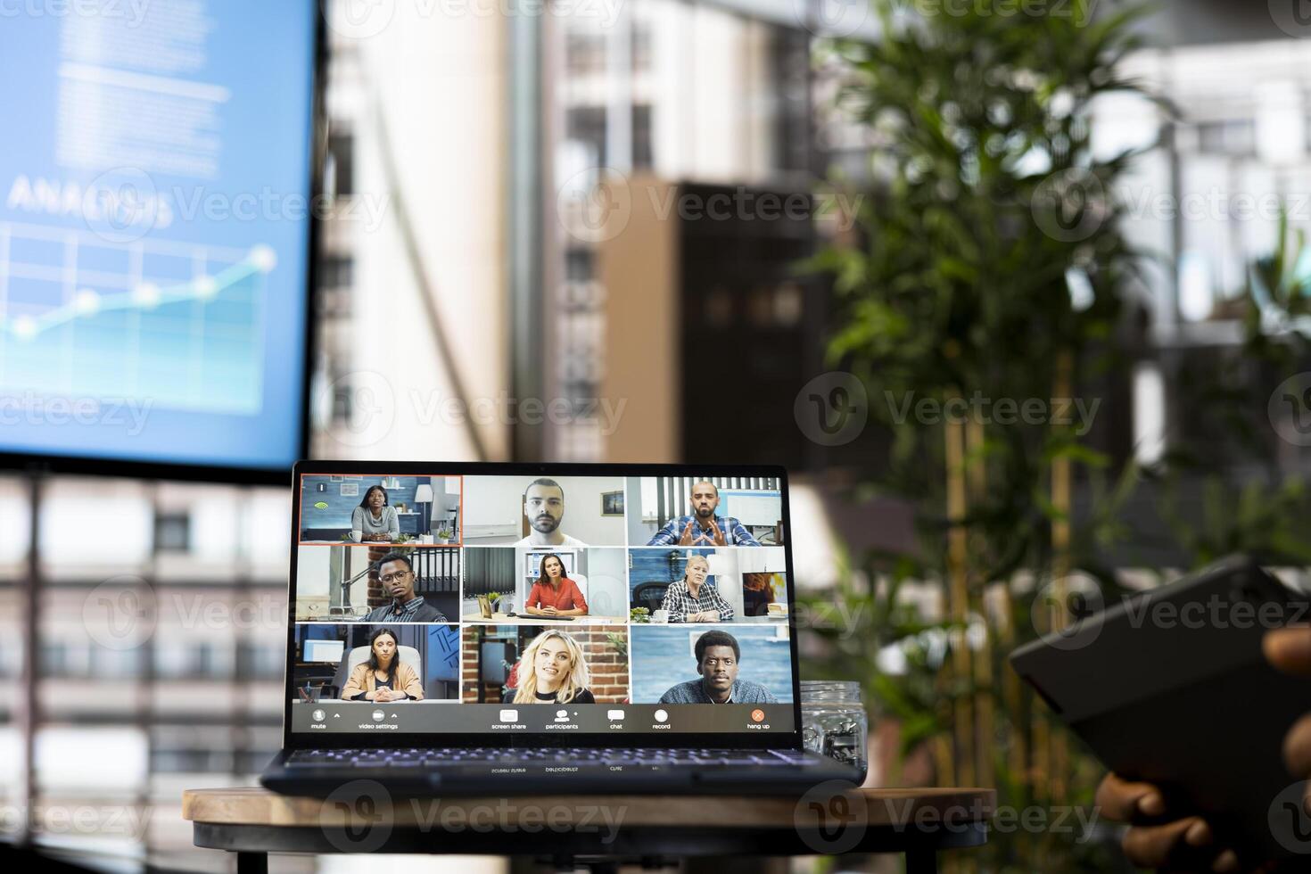 Employee doing videocall with customers in company office. Manager talking over online teleconference meeting with business partners inquiring about commissioned project progress photo