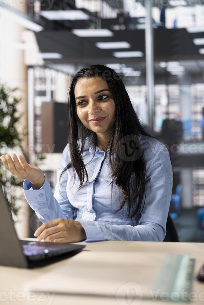 Company executive hosts an online meeting to discuss business operations and performance metrics. conference enables real time collaboration and goal setting for the enterprise. photo