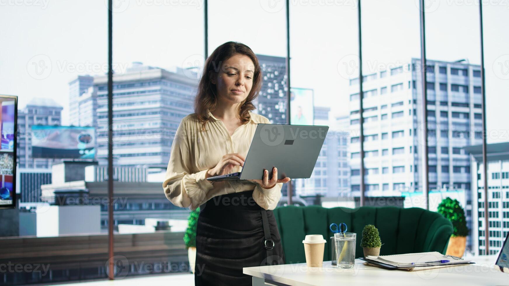 Ambitious woman director oversees a strategic review of the enterprise activity, analyzing market trends and setting new priorities. Ensuring the company objectives achievements. Camera A. photo