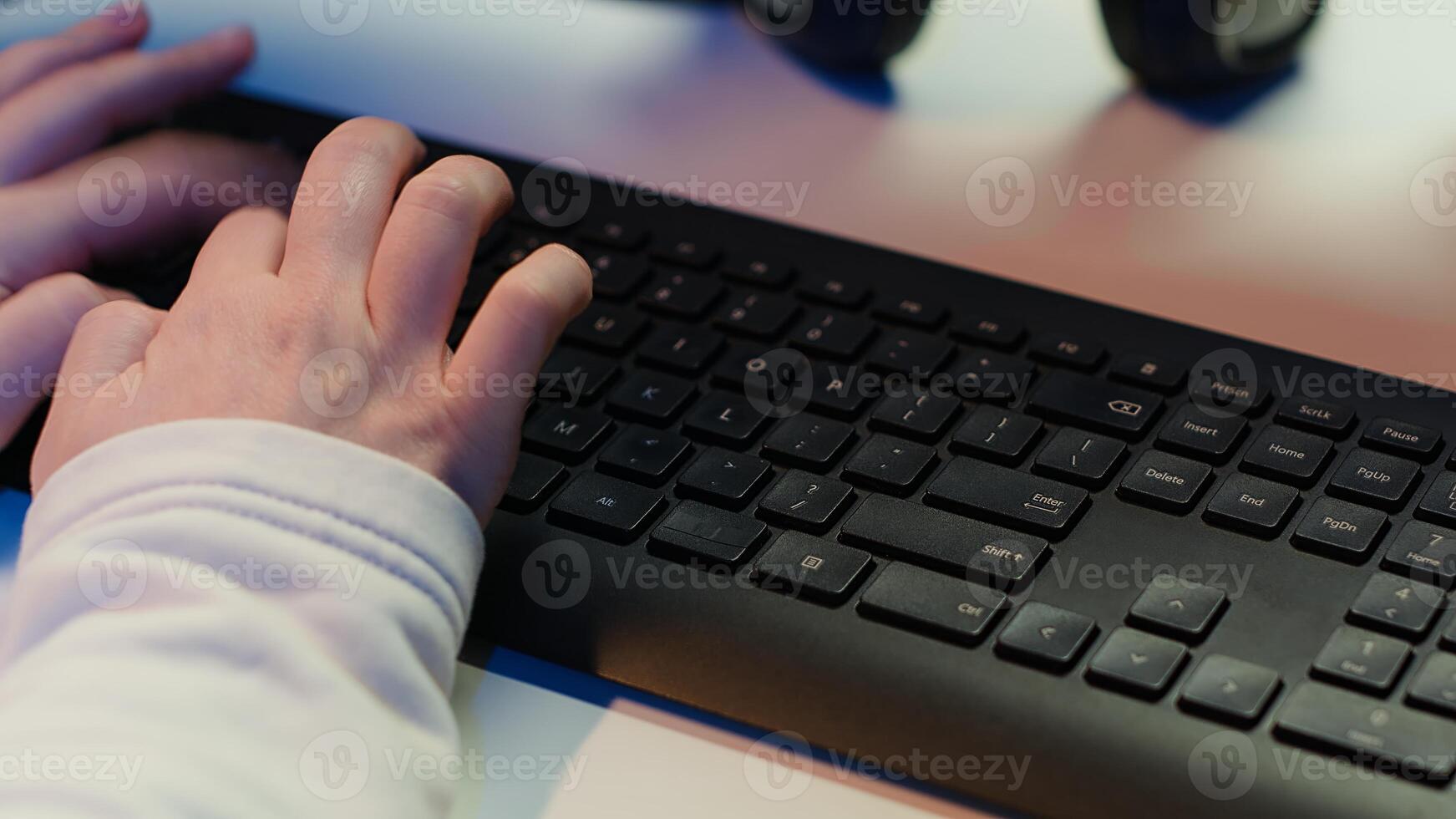 Computer technician working from home, designing and developing software applications, close up. IT specialist typing on PC keyboard, implementing and maintaining company systems, camera A photo