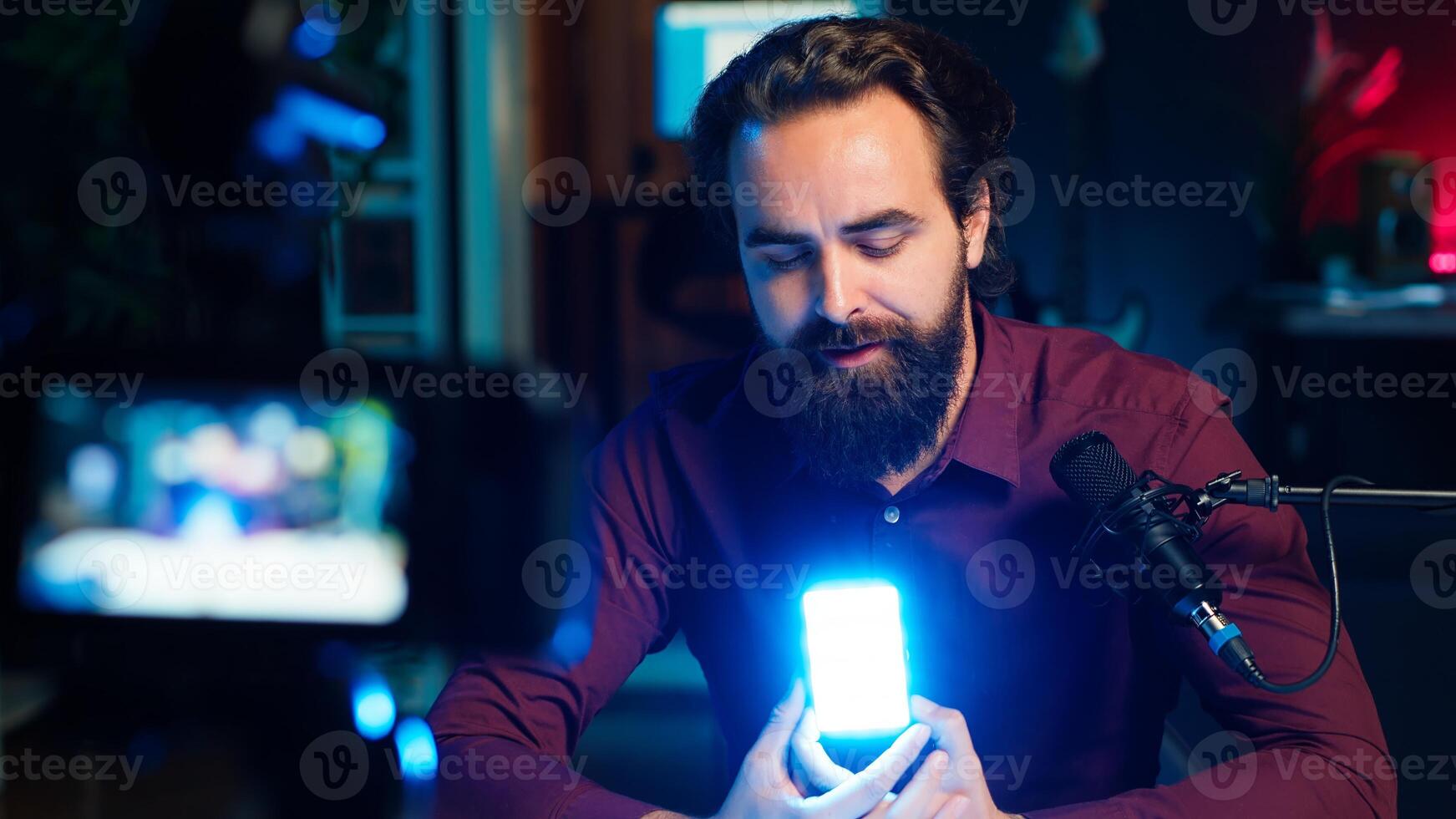 Tech guru filming technology review of mini led lights, offering feedback, close up shot. Friendly online star showing filming equipment to subscribers, talking in mic, camera A photo