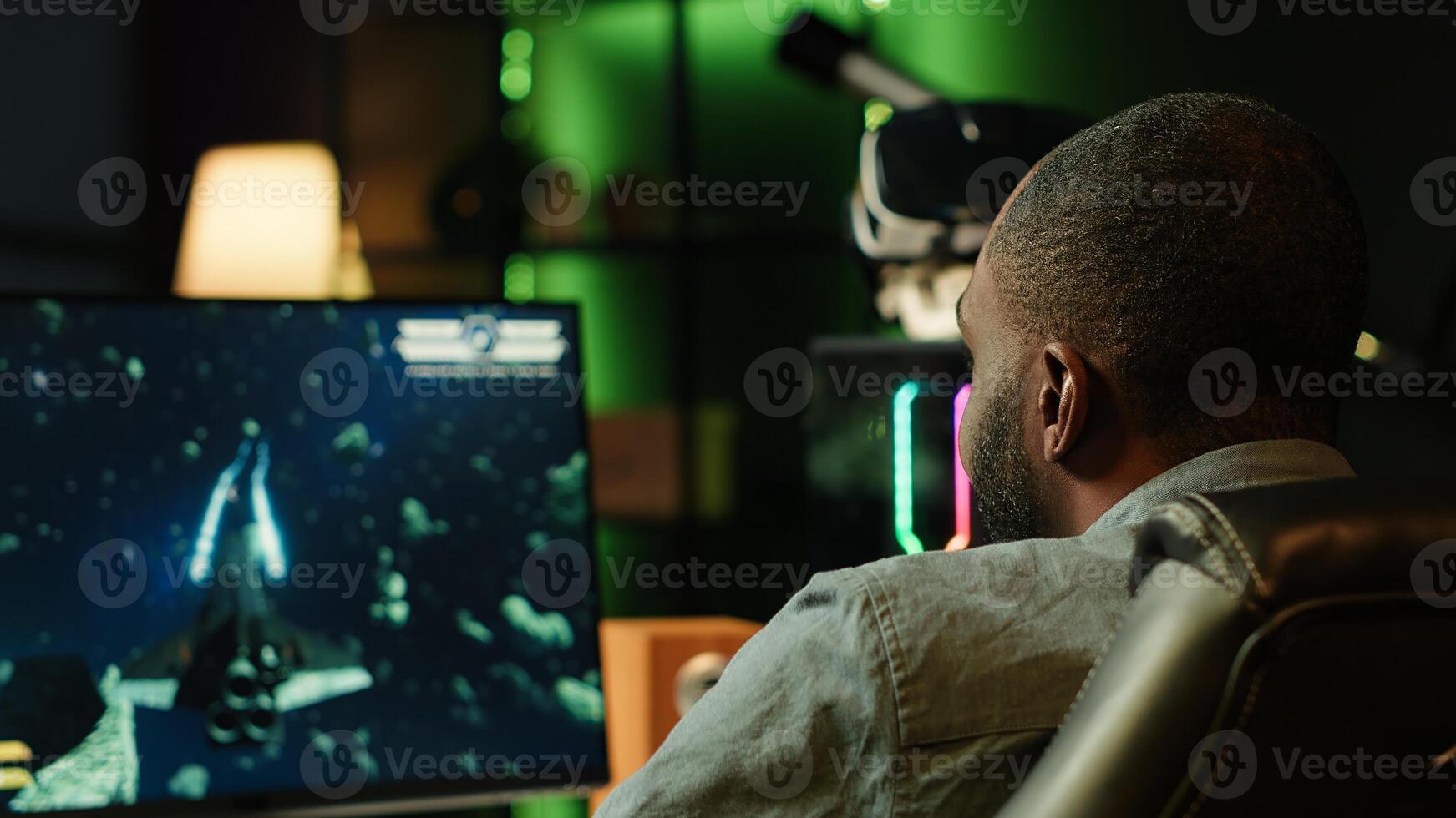Player at home shooting asteroids in spaceship flying singleplayer game with overlay HUD showing health levels on monitor. Close up of person navigating universe in simulation game on PC photo